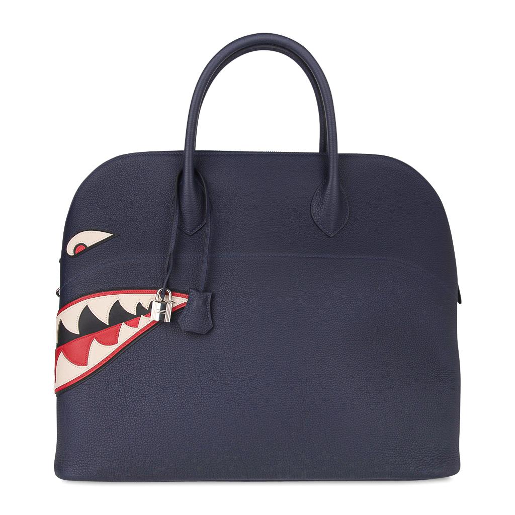 Mightychic offers a rare and very limited edition Blue Indigo Shark Bolide is detailed by beautiful inset leather and 
top stitch detailing.
This runway Monster Bolide is a testament to Hermes sense of mobility and speed expressed in this fun,