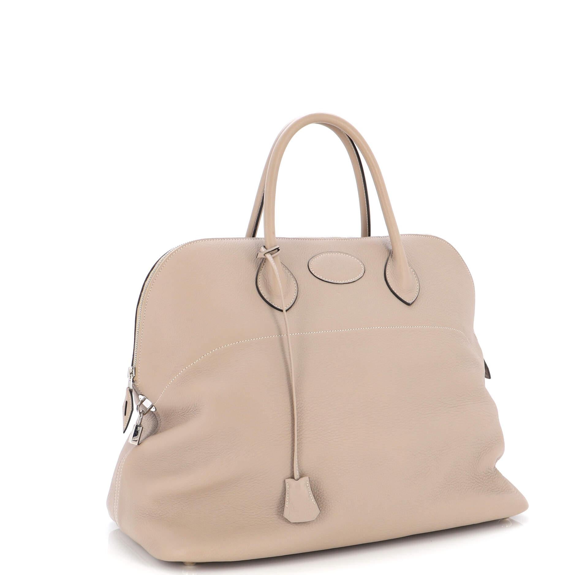 Condition: Great. Creasing on exterior, indentations on base, minor wear on base corners and handles. Slight peeling on handle wax edges, light wear in interior, scratches on hardware.
Accessories: Keys, Lock, Clochette
Measurements: Handle Drop