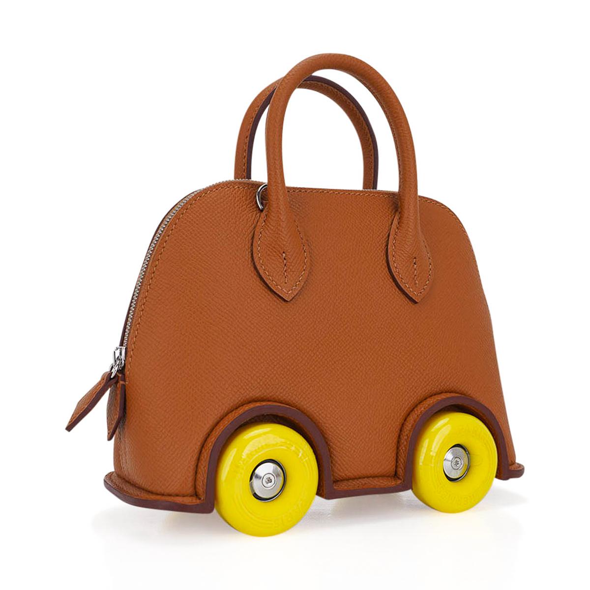 Mightychic offers a Limited Edition Hermes Bolide on Wheels featured in Gold.
Created for the re-opening of the Madison Avenue Hermes Store in 2022.
A true nod to the creative whimsy and innovative imagination of Hermes.
This rare treasure is a must