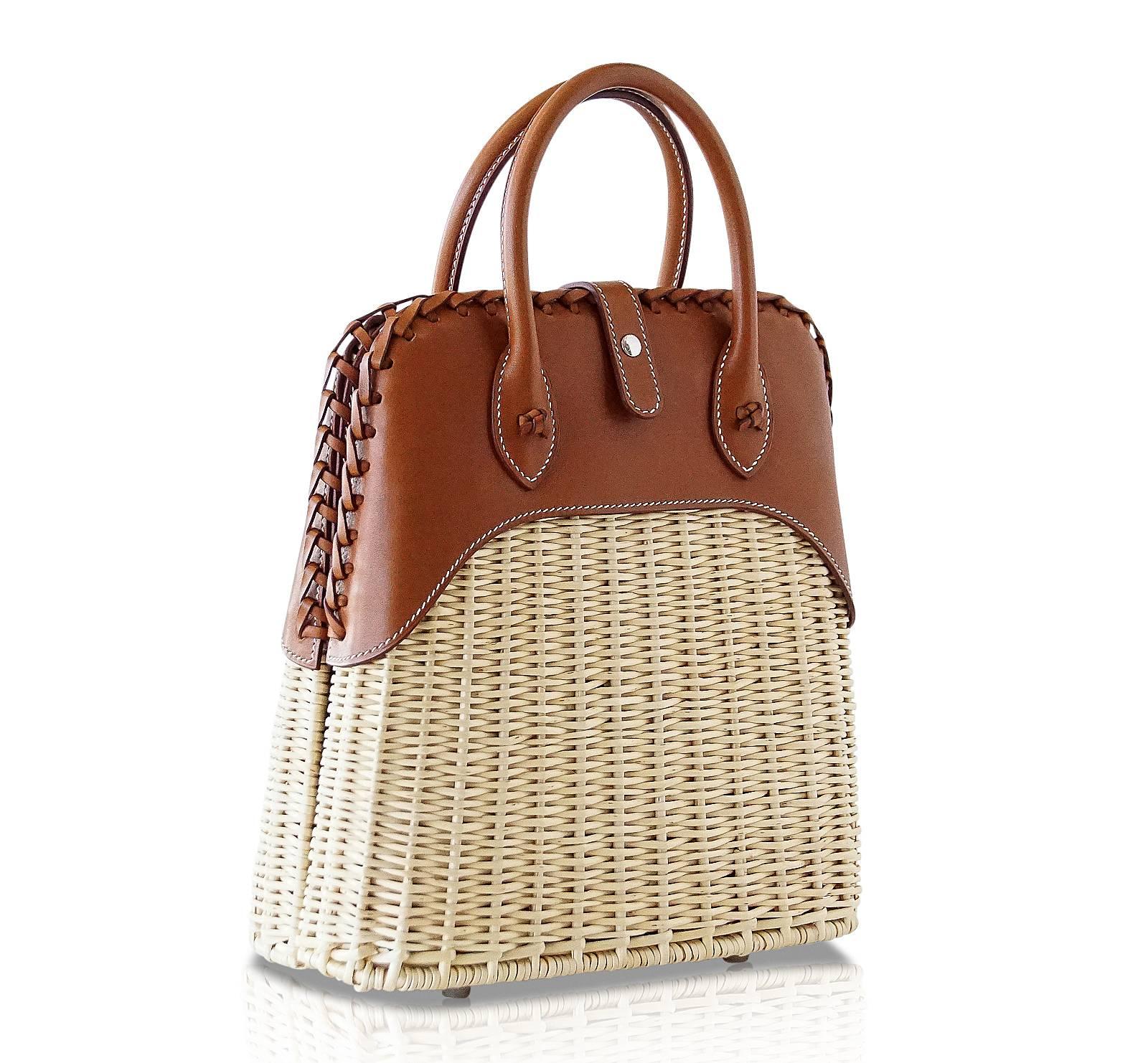 Guaranteed authentic rare to find Limited Edition Hermes Picnic Bolide.
Light weight wicker and the warmth of Barenia leather.  The ultimate chic bag for any summer day - dress her up or down.
Top has a beautifully braided edge.
Front closure is the