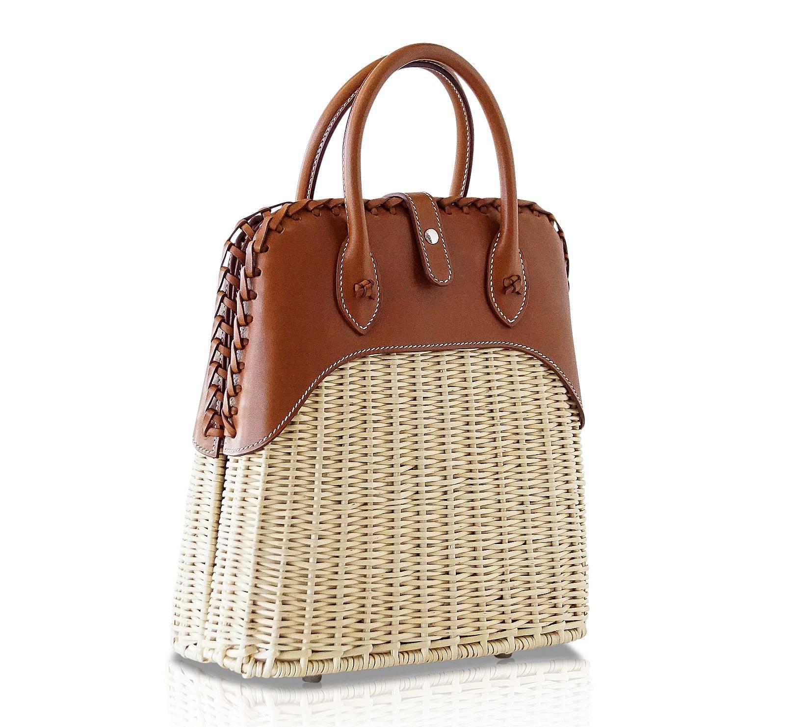 Mightychic offers a rare to find Limited Edition Hermes Picnic Bolide.
Light weight wicker and the warmth of Barenia leather.  The ultimate chic bag for any summer day - dress her up or down.
Top has a beautifully braided edge.
Front closure is the