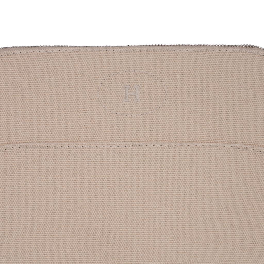 Mightychic offers a guaranteed authentic Hermes Bolide travel case - Trousse de Voyage - 
featured in Naturel cotton canvas.
Zipper toggle has lambskin leather pull and base has leather trim.   
This charming waterproof lined travel case has the