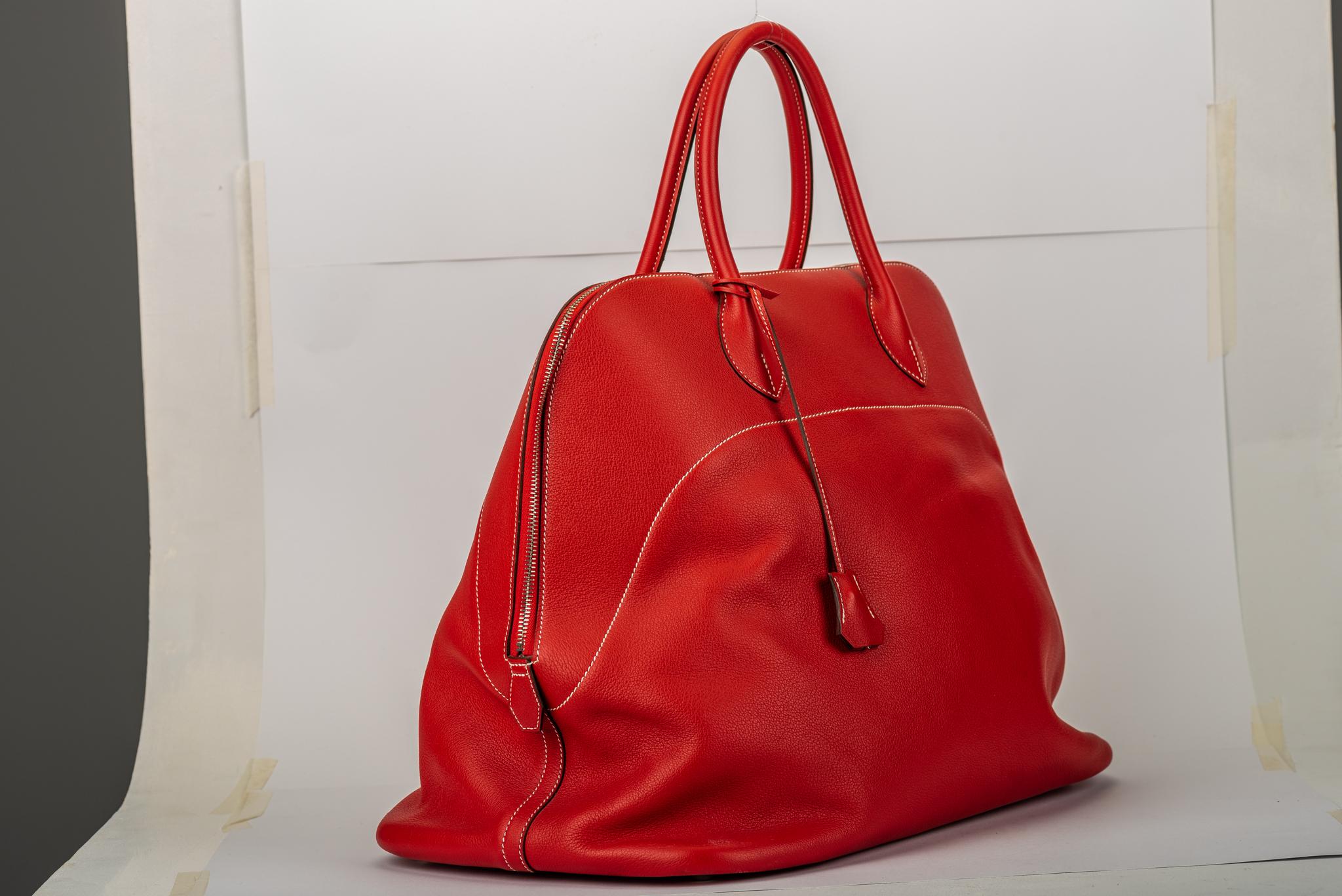 Hermes rare large bolide voyager 45cm in red sikkim leather with contrast white stitching and palladium hardware. The interior is lined in herringbone toile, which makes the bag look more relaxed and lightweight. Handle drop 4
