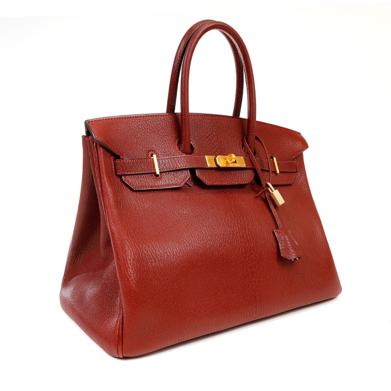 This authentic Hermès Bordeaux Chevre 35 cm Birkin is in excellent condition.  Chevre (goat hide) is a highly sought after leather as it is scratch resistant with a lovely texture.  This unique Birkin is a brilliant find.  
Luxe Bordeaux red chevre