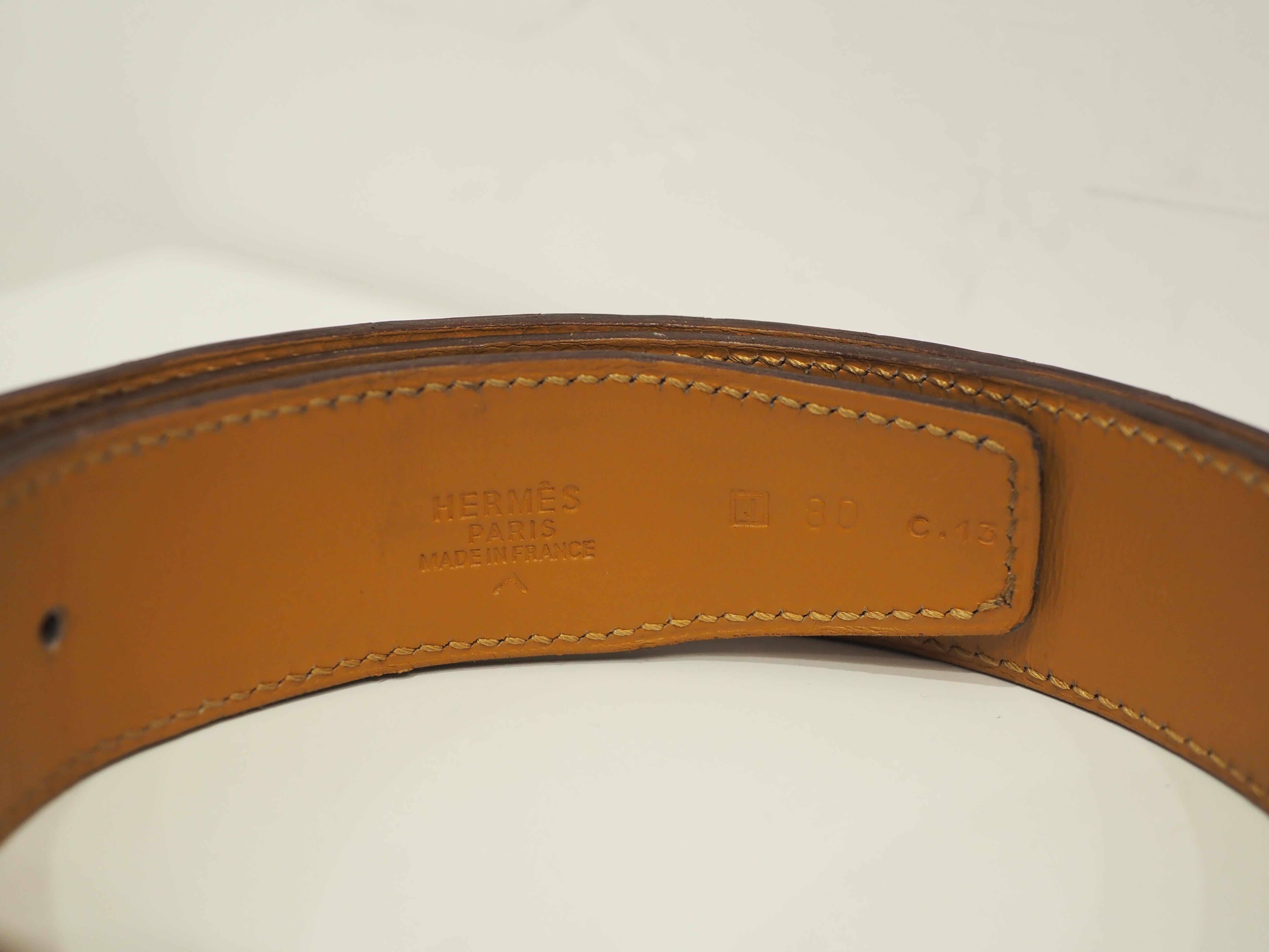 Ceinture Hermès en cuir de croco bordeaux et métal argenté 4