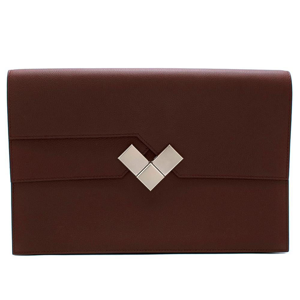Hermes Bordeaux Evercolor Calfskin Fortunio Clutch

-Made of super soft and supple evercolor calfskin
-V shaped double fastening to the front 
-Interior divided into 2 sections
-Small interior pocket
-Original box 
-Age: A-2017
-Elegant timeless