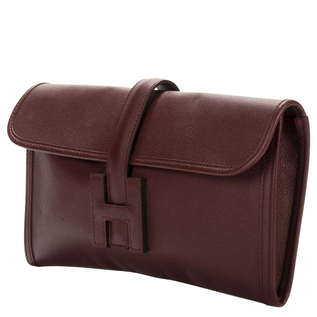A sleek Bordeaux Gulliver leather clutch with a foldover flap opening to a leather interior, epitomizing minimalist elegance.

SPECIFICS
Length: 11.4
Width: 0.8
Height: 5.9
Authenticity code: ACT010AX
Comes with: SDC Dust bag
