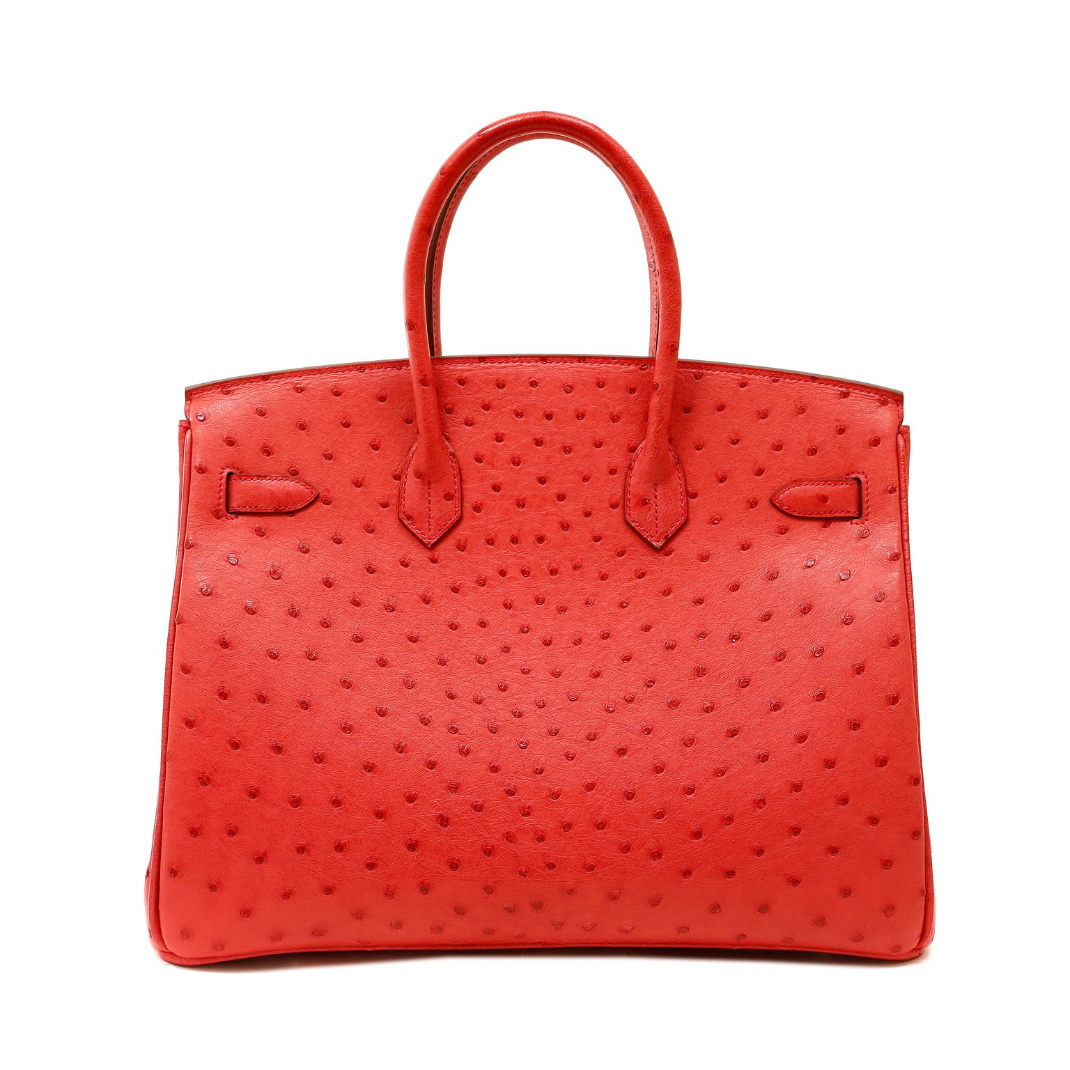 This authentic Hermès Bougainvillea Ostrich 35cm Birkin is in pristine unworn condition with the protective plastic intact on the hardware. Hermès bags are considered the ultimate luxury item the world over.  Hand stitched by skilled craftsmen, wait
