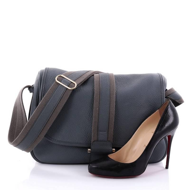 This authentic Hermes Bourlingue Messenger Bag Clemence is the perfect bag for your daily excursions. Crafted in blue orage clemence leather, this chic and stylish messenger bag features an adjustable shoulder strap, grown canvas trims, exterior