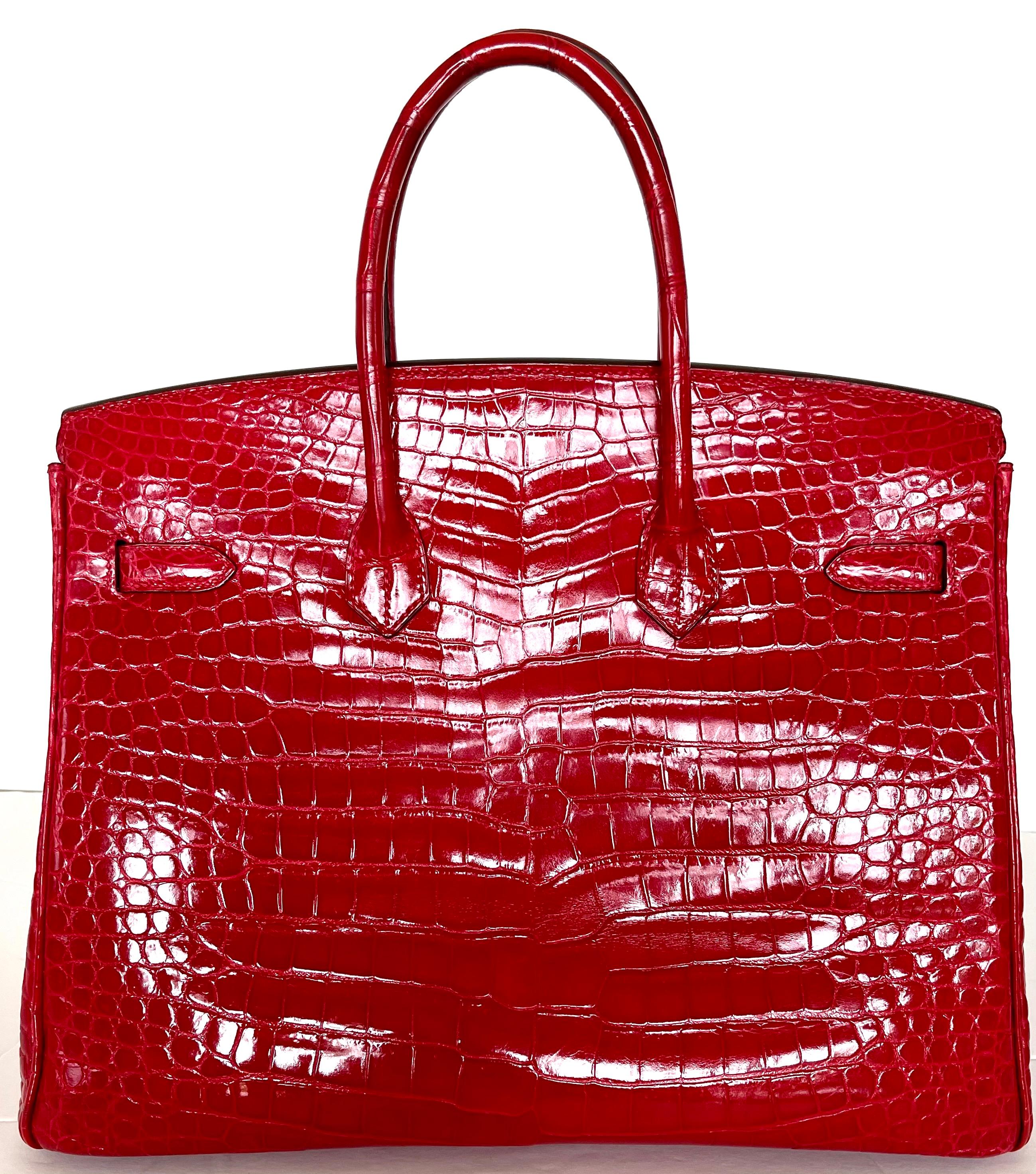 This Birkin is in Braise Shiny Porosus crocodile with gold hardware and has tonal stitching, a front toggle closure, a clochette with lock and two keys, and double rolled handles.

 

The interior is lined with chevre and has one zip pocket with an