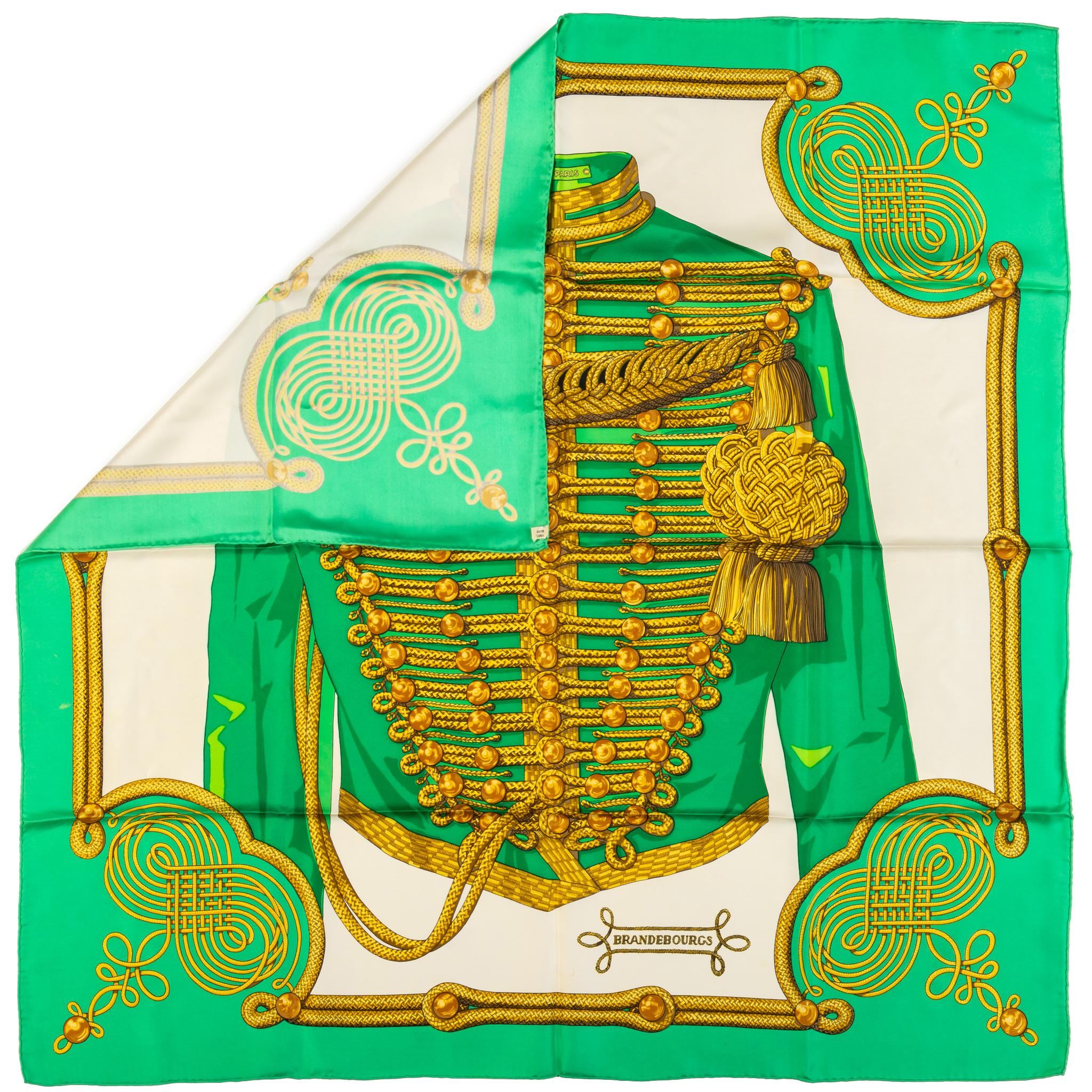 Hermès 100% silk twill coveted Brandebourg green and white scarf by collectible designer Cathy Latham. Hand-rolled edges. Does not include box. Minimal wear, small discoloration, please refer to photo.