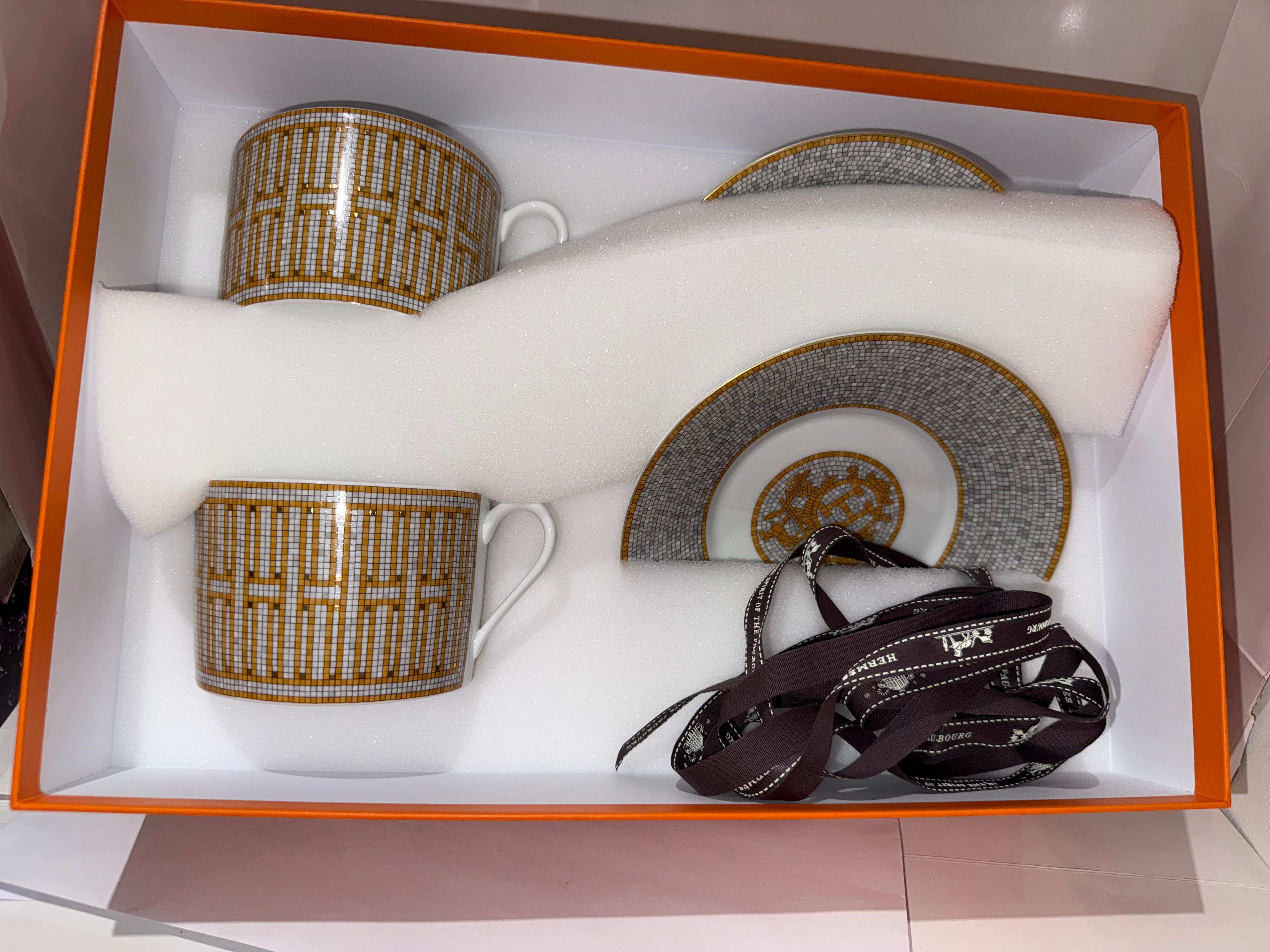 Hermes big Breakfast cup and saucer in porcelain 
With Decorative mosaics are screen-printed and applied by hand using gold tiles.
With its geometric pattern, the Mosaique au 24 gold collection reflects the original decor of the store at 24 Faubourg