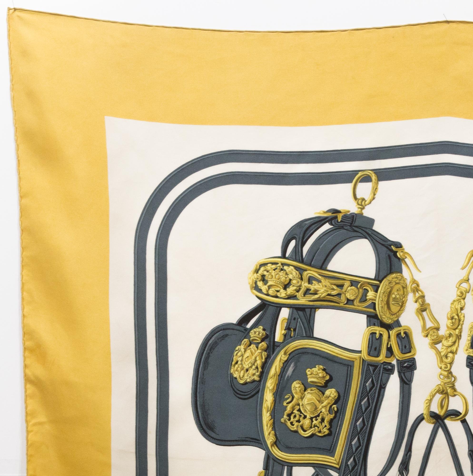 Hermès brides de gala by Hugo Grygkar silk scarf featuring a yellow border, a Hermès signature. 
Circa 1959
In good vintage condition. Made in France.
35,4in. (90cm)  X 35,4in. (90cm)
We guarantee you will receive this  iconic item as described and