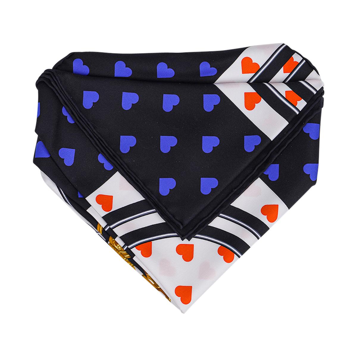 Mightychic offers a guaranteed authentic Limited Edition Le Carre Brides de Gala Love scarf. 
The most beloved scarf ever produced in the world!
Border is black with blue hearts with the central section in white with orange hearts showcasing the