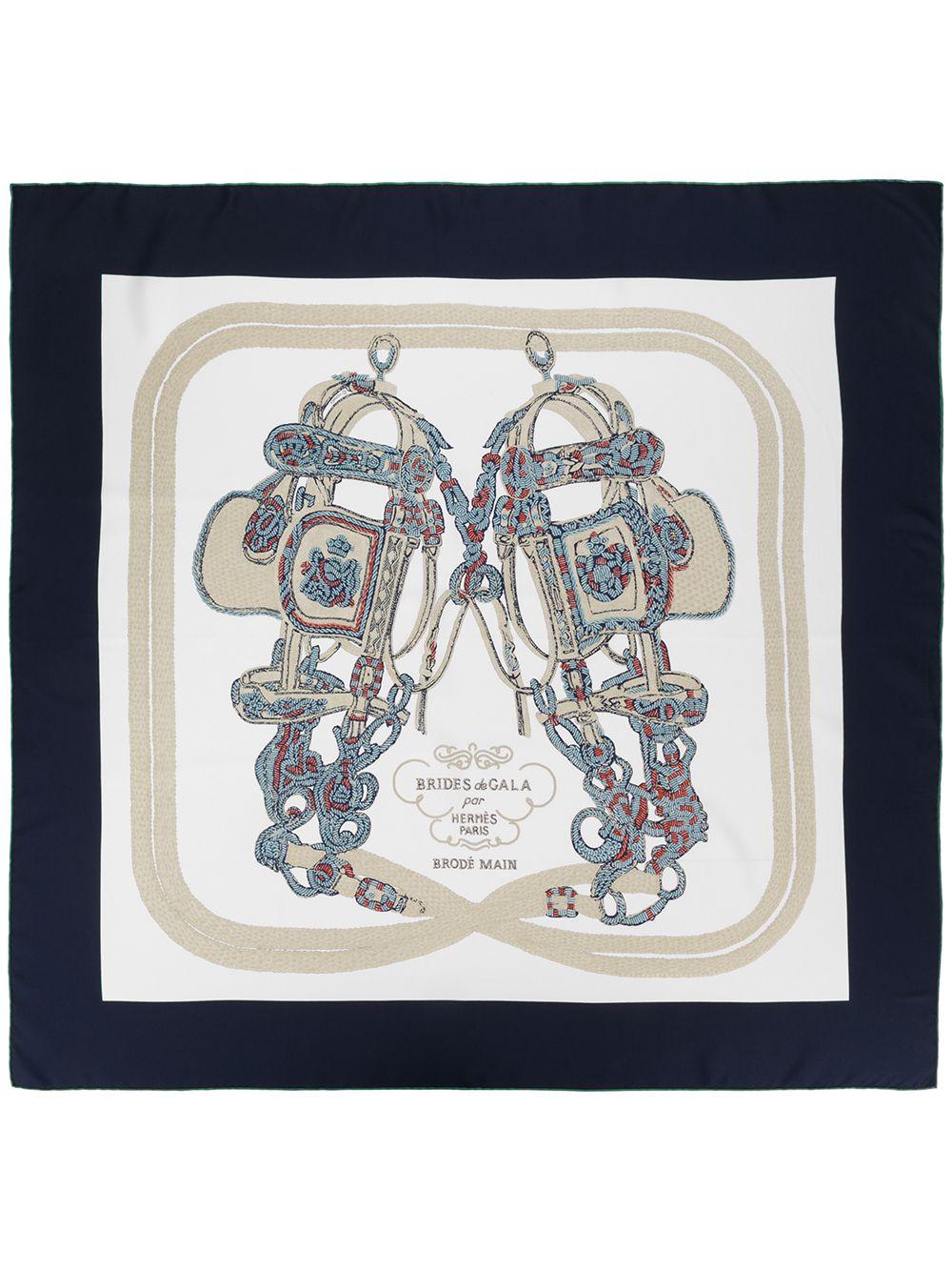 Crafted in France from the finest white silk, this pre-owned scarf by Hermès features a lightweight construction, a square shape and an elegant, central 'harness' print in a myriad of beige, blue and red tones. For an added touch of sophistication,