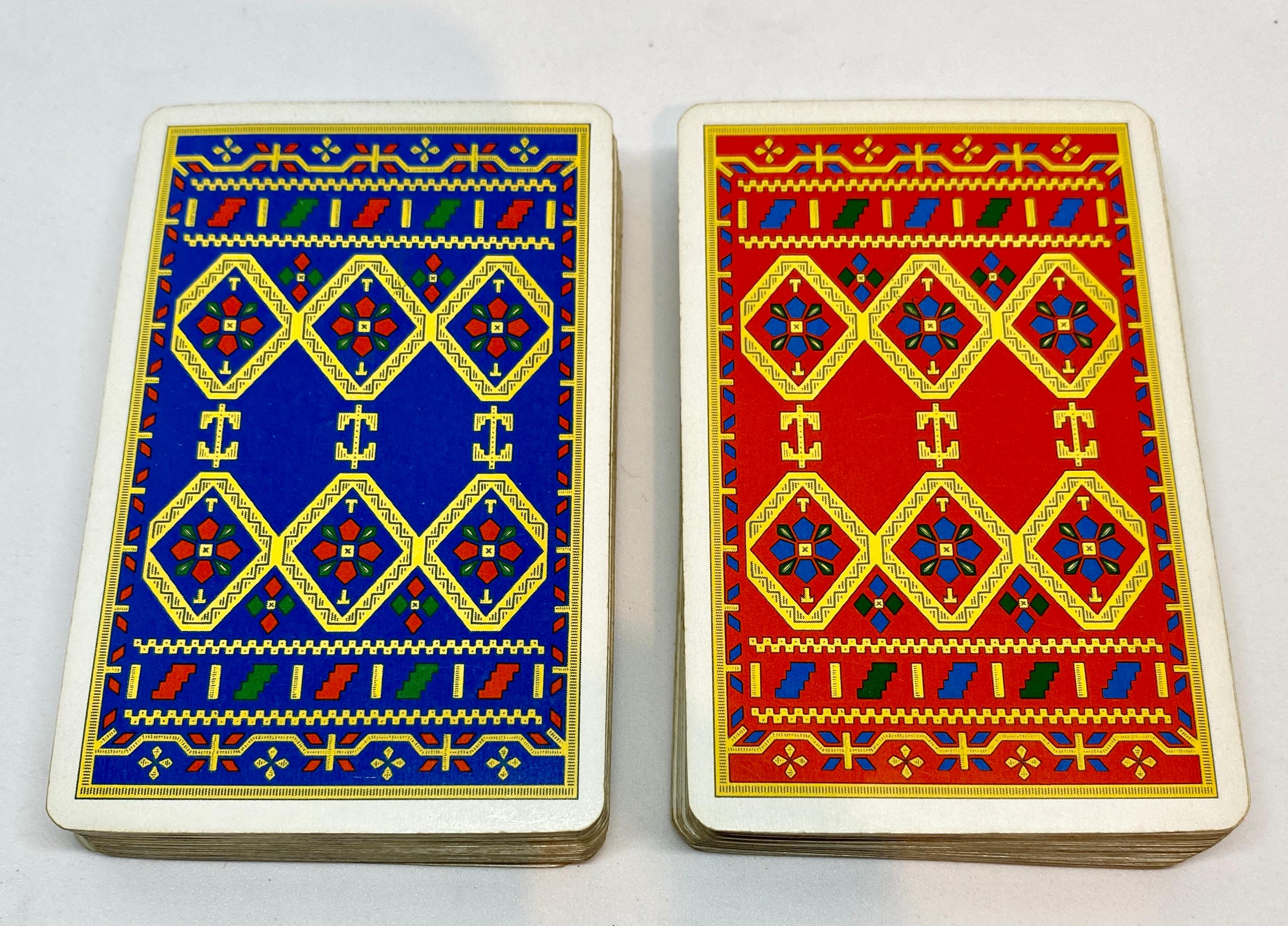 Two complete sets of vintage playing cards in a fitted green leather case signed Hermès Paris.

The playing cards feature gilt edges and are in excellent vintage condition. The Ace of Clubs in both decks features the Hermès logo and 