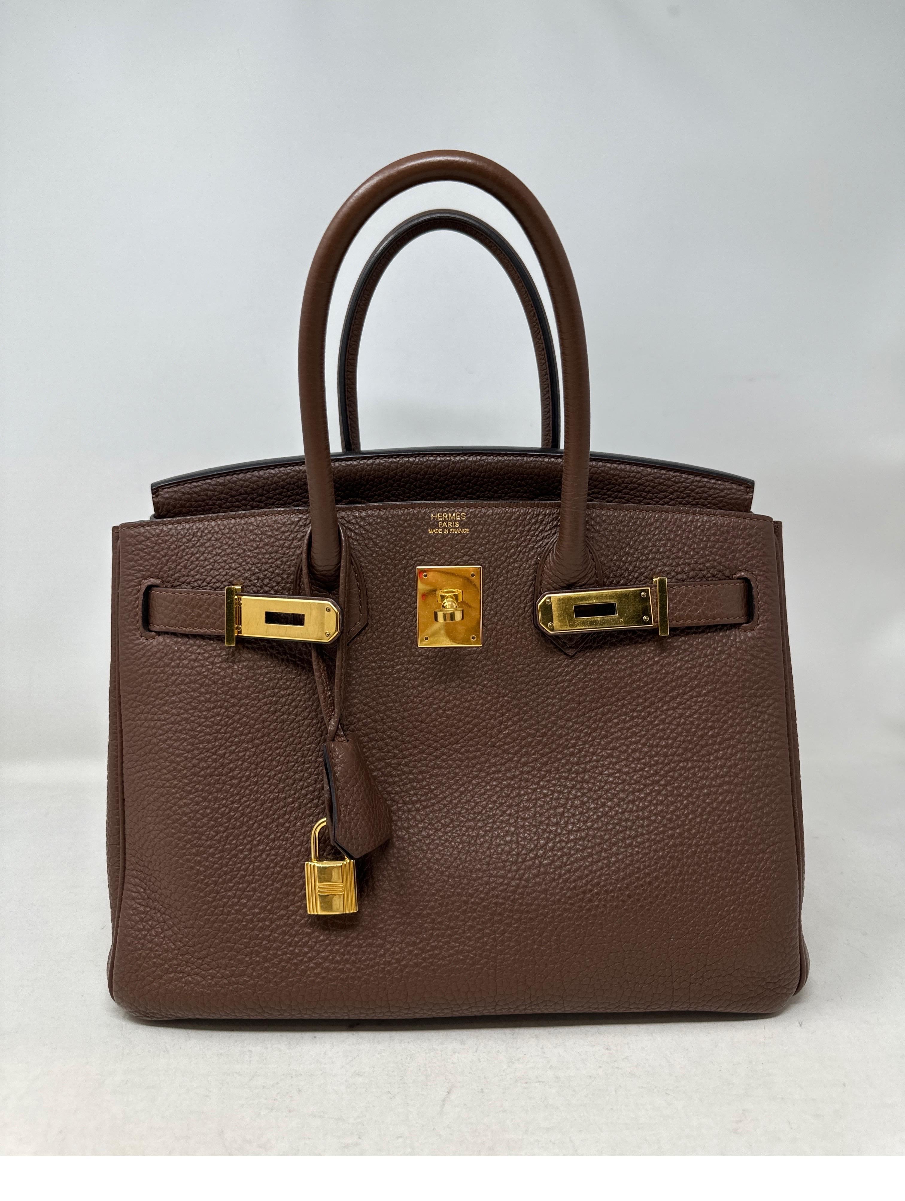 Hermes Brown Birkin 30 Bag. Neutral brown color with gold hardware. Togo leather. Interior clean. Good condition. Includes clochette, lock, keys, and dust bag. Guaranteed authentic. 