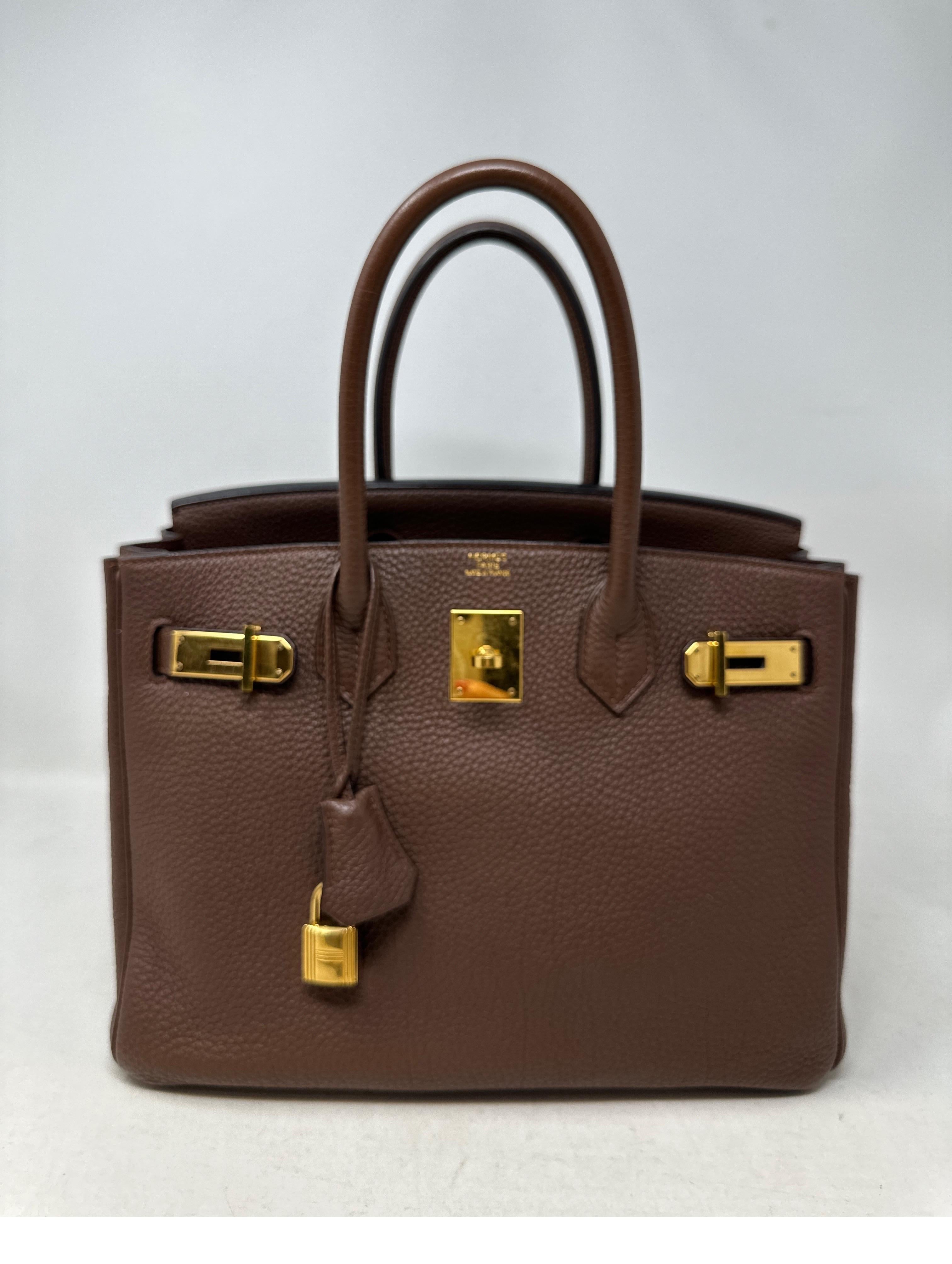 Hermes Brown Birkin 30 Bag. Gold hardware. Chocolate browm color. Togo leather. Gold hardware has some surface scratches. Leather is excellent condition. Interior clean. Includes clochette, lock, keys, and dust bag. Guaranteed authentic. 