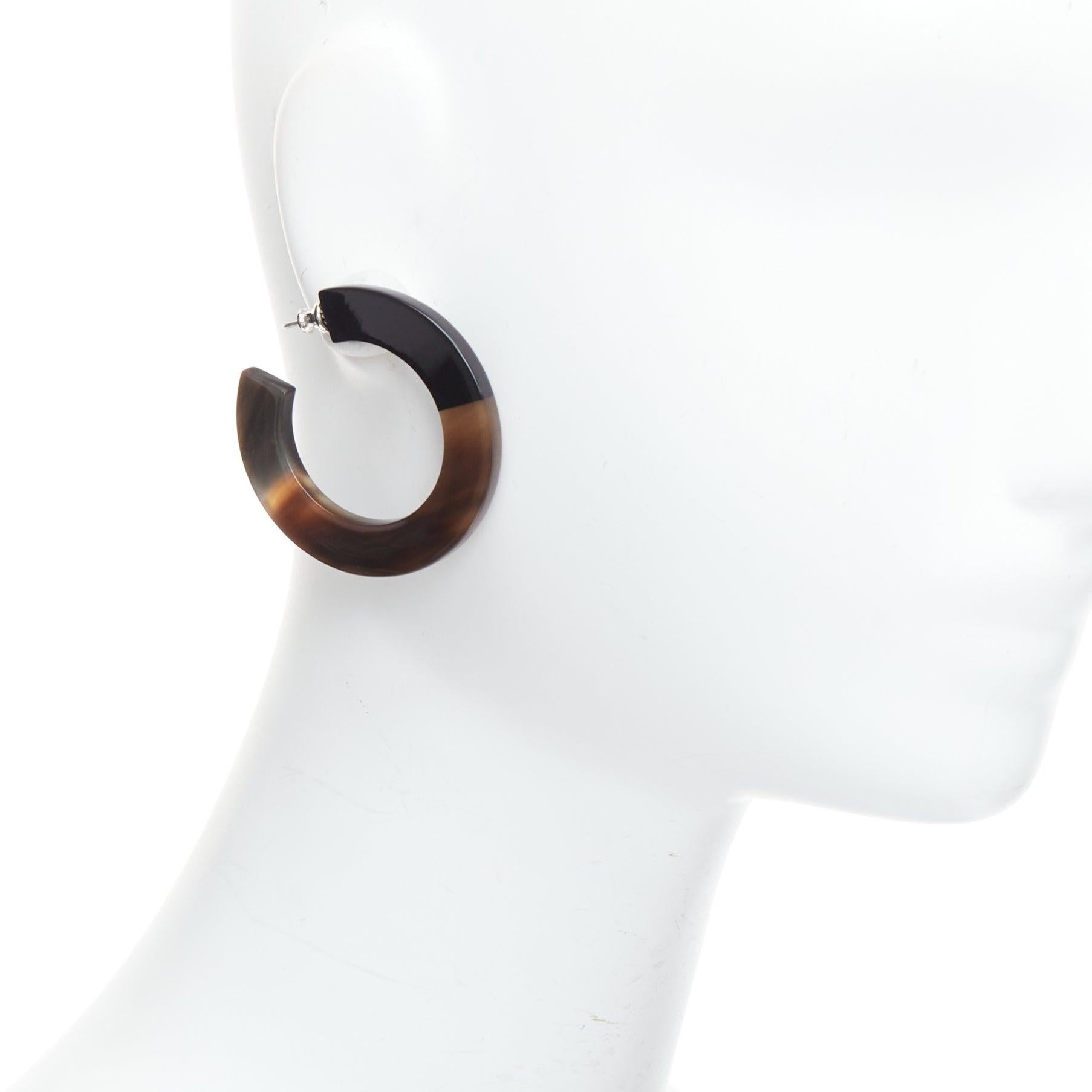 HERMES brown black buffalo horn palladium hoop pin earrings Pair
Reference: NKLL/A00379
Brand: Hermes
Material: Others, Metal
Color: Brown, Black
Pattern: Solid
Closure: Pin
Extra Details: Elegant and rare Hermes hoop earrings in buffalo horn with