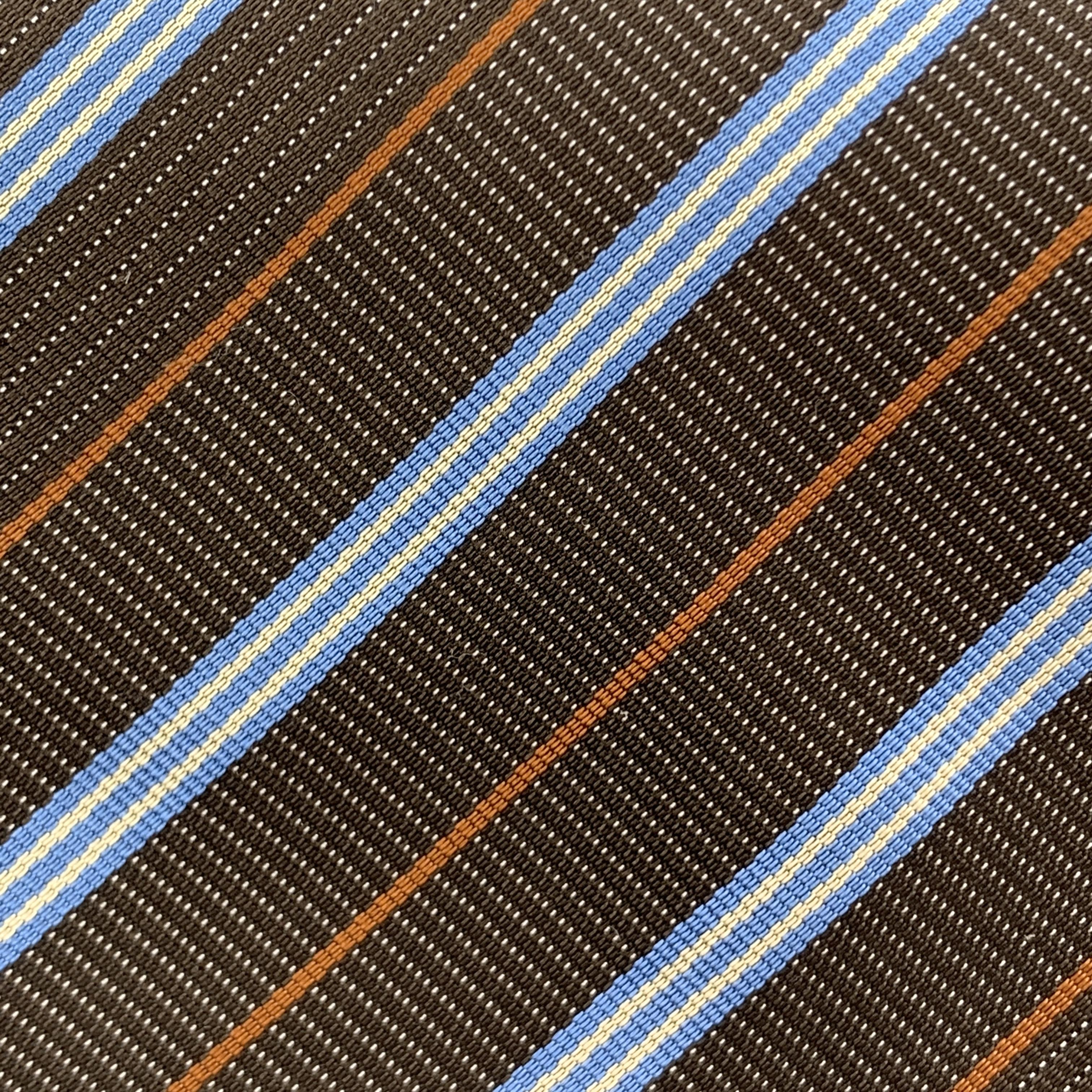 HERMES necktie comes in brown woven textured silk with all over blue and rust diagonal stripe print. Made in France.

Excellent Pre-Owned Condition.

Width: 3.75 in. 