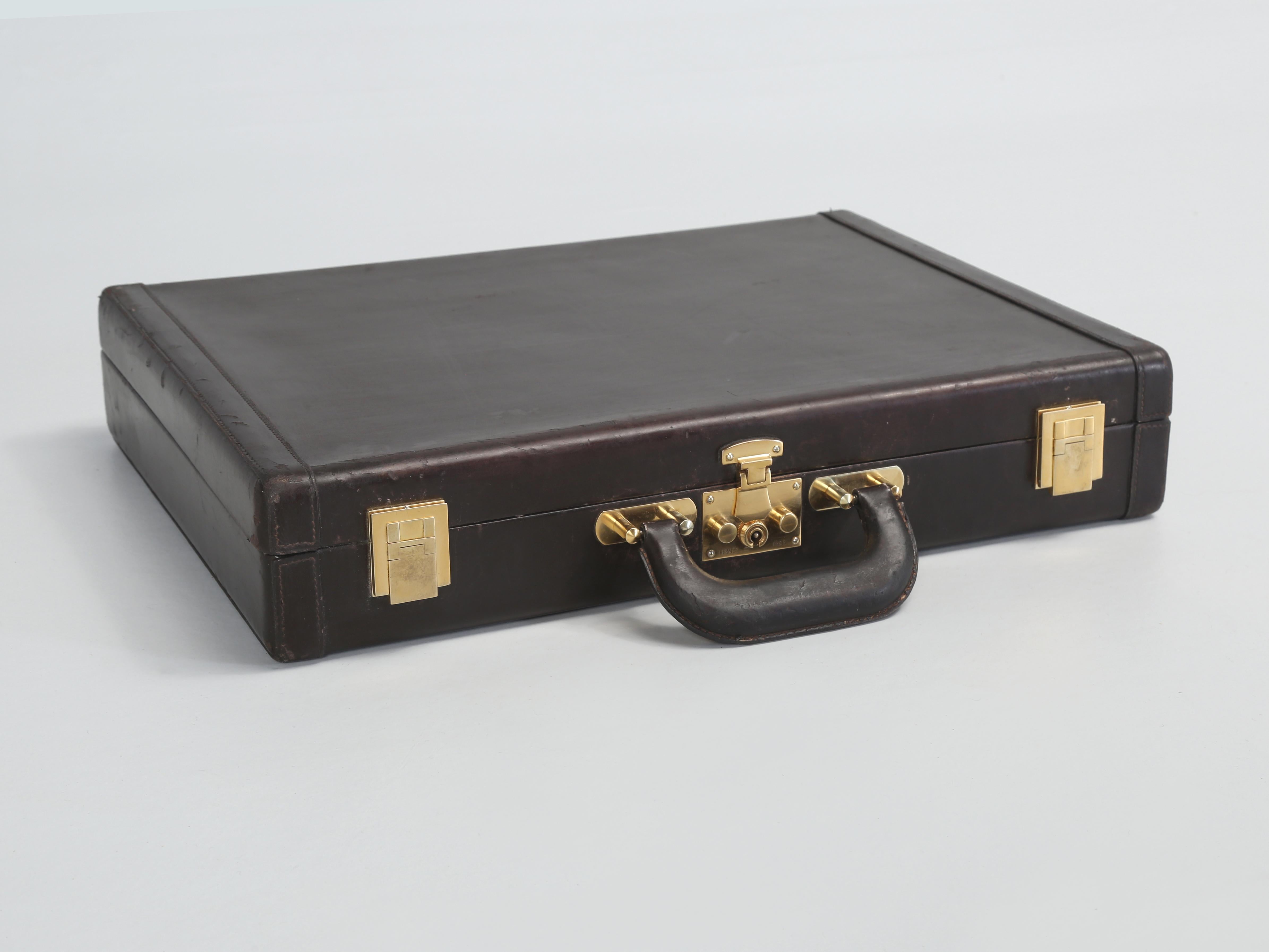 Hermès Men's Briefcase or Attaché Case in chocolate brown leather with gold fittings. 
Hermès originally began as a producer of high-end leather equestrian accessories for European noblemen. In the late 1830's French entrepreneur Thierry Hermès