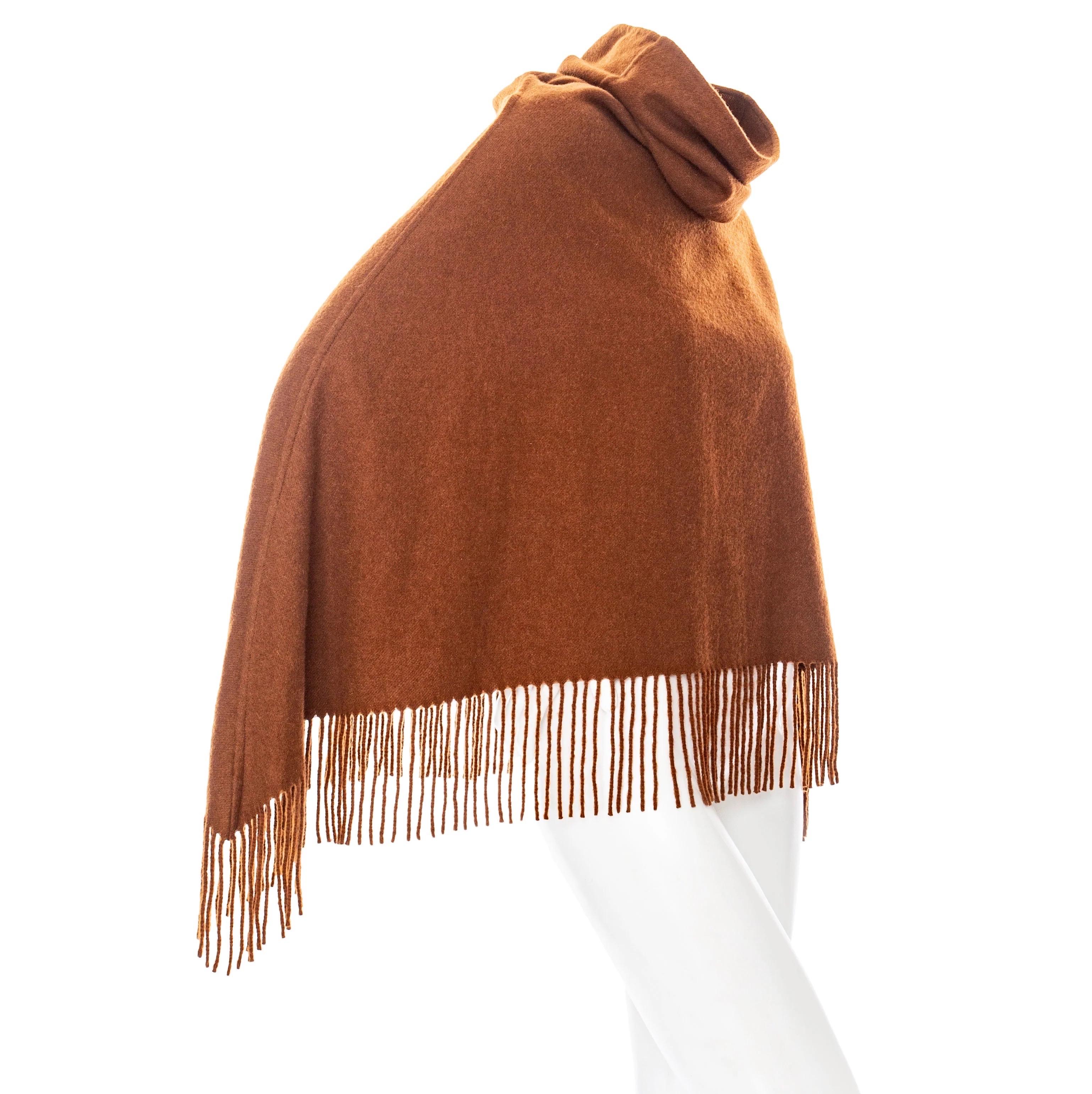 Hermès Brown Cashmere Fringed Cowl-Neck Poncho

Brown / Ochre
Cowl turtleneck
Fringed edge
Pullover
Short
Made in France
100% cashmere
Excellent preowned condition with little to no signs of wear and no notable flaws
Size & Measurements
Approximate,
