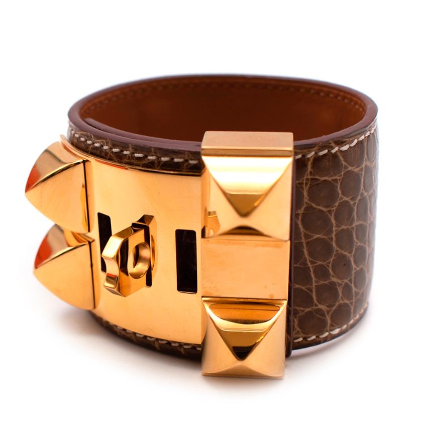 Hermes Brown Collier de Chien Alligator Bracelet

-Iconic Hermes design 
-Smooth Mississippiensis alligator skin 
-Gold plated hardware 
-Medor pyramid studs and ring details 
-Luxurious smooth leather lining 
-Adjustable fastening to the back with