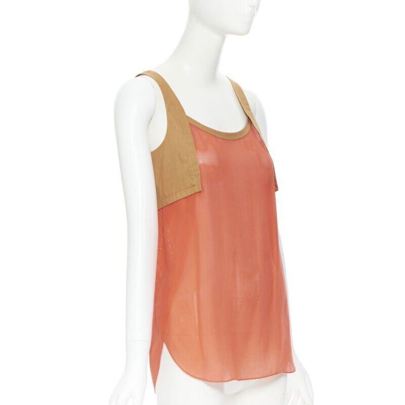 HERMES brown cotton harness orange gauze rounded hem summer top FR34 XS
Reference: TGAS/B00124
Brand: Hermes
Model: Tank top
Color: Orange, Brown
Pattern: Solid
Extra Details: Rounded hem. Brown cotton harness design at sleeves.
Made in: