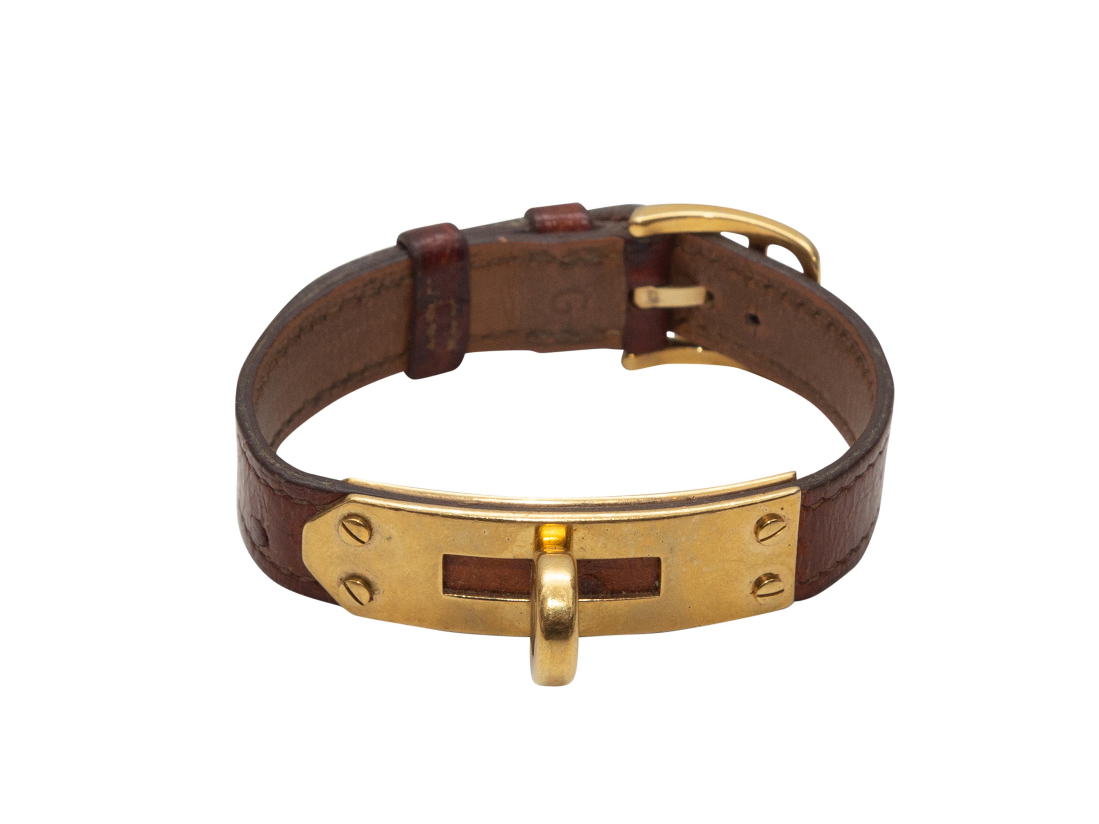Product details: Vintage brown ostrich leather Kelley bracelet by Hermes. Circa 1987. Gold-tone closure. 0.5