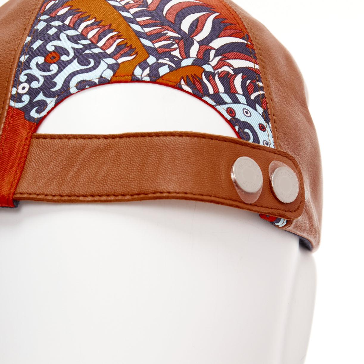 HERMES brown lambskin leather navy orange cotton silk scarf patch cap 58cm
Reference: AAWC/A00929
Brand: Hermes
Material: Leather, Cotton, Blend
Color: Brown, Navy
Pattern: Geometric
Closure: Snap Buttons
Lining: Orange Fabric
Extra Details: Snap