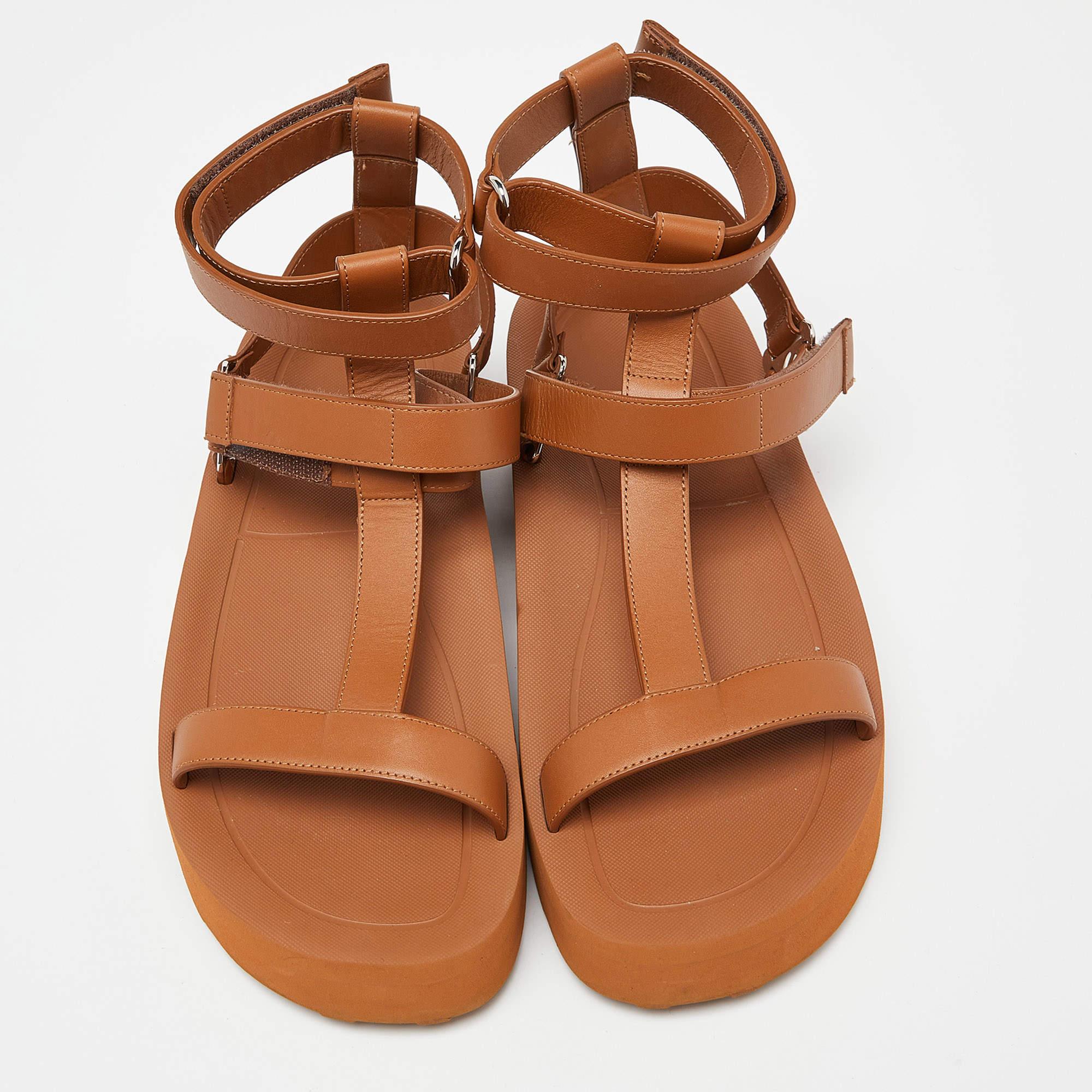 The Hermès Enid sandals are a luxurious and stylish footwear choice. Crafted from high-quality brown leather, these sandals feature a classic gladiator design with multiple straps, a comfortable footbed, and the iconic Hermès craftsmanship. Perfect