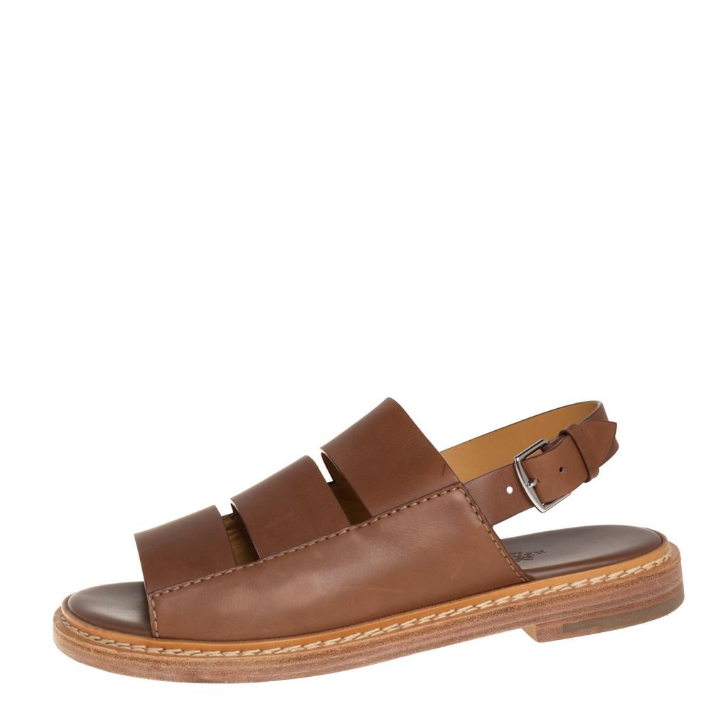 These striking and trendy Hermes sandals will elevate your casual ensembles instantly. Crafted from brown leather, they are styled with open toes, multiple straps on the uppers, buckled slingbacks, and a strudy soles.

Includes: Original Dustbag