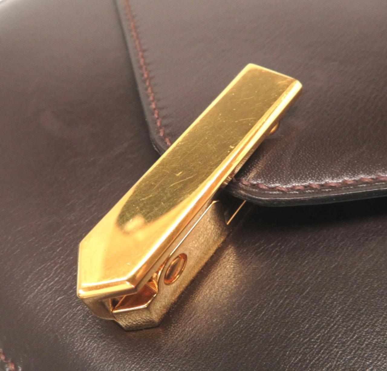 
Leather
Gold tone hardware
Leather lining
Hinge closure 
Made in France
Adjustable shoulder strap drop 18-32