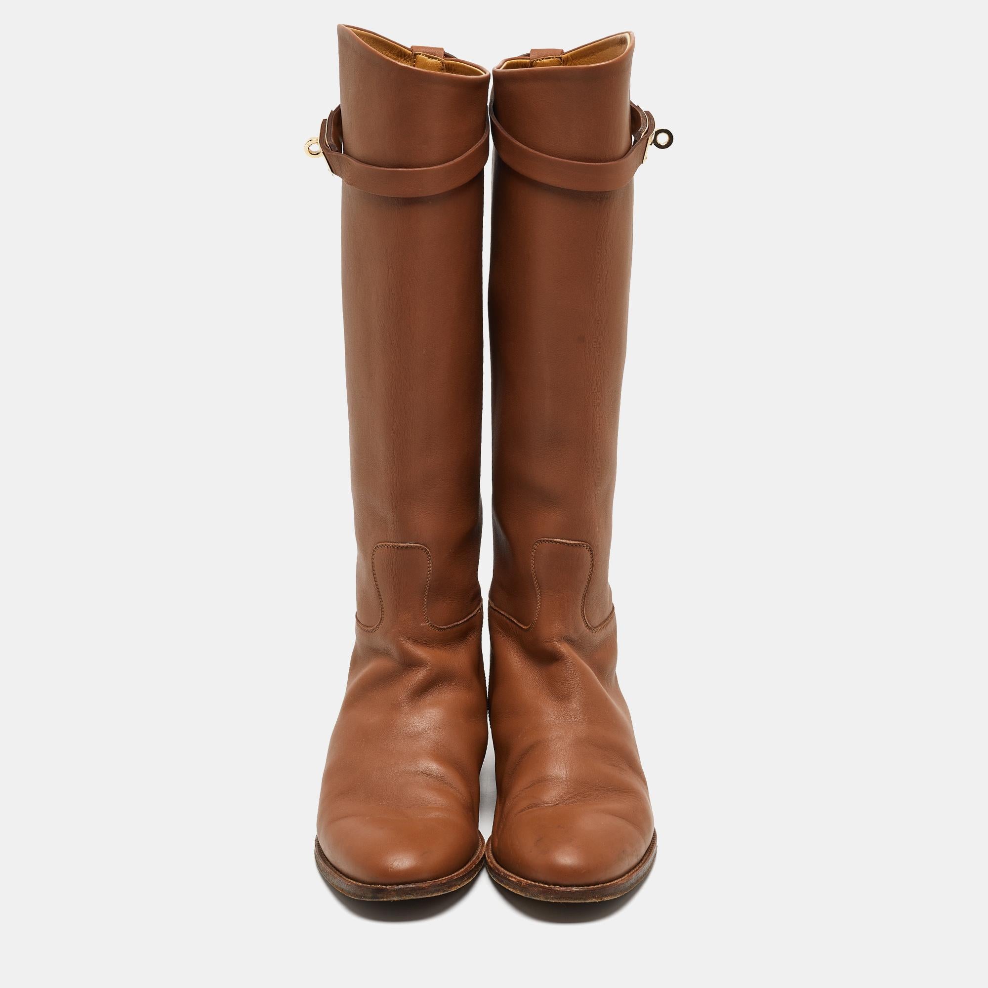 If you're looking to add a pair of knee-length boots to your collection, it should be this one from Hermes! The brown boots are crafted from leather into a chic silhouette and finished with signature lock straps.

