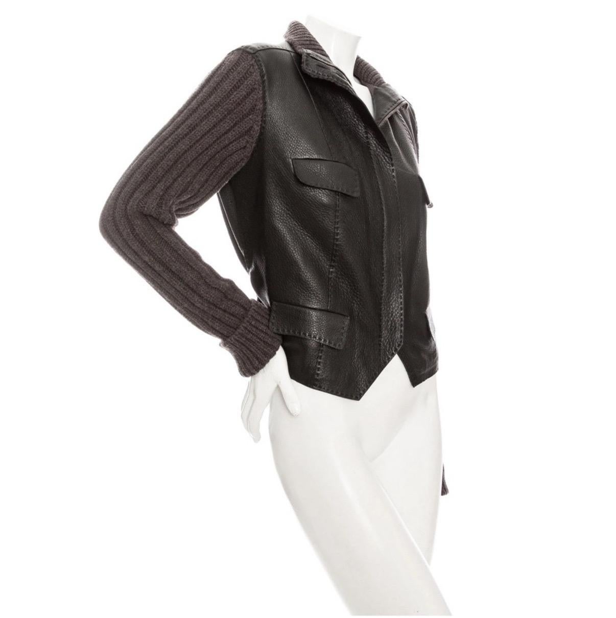 Hermès Brown Leather Knit Sleeve Biker Jacket

Muted Brown/Dark Brown
Leather body
Front flap pockets
Concealed zipper closure with button fastening
Ribbed knit collar and sleeves
Adjustable back strap
Pointed hemline
100% deerskin leather; 90%