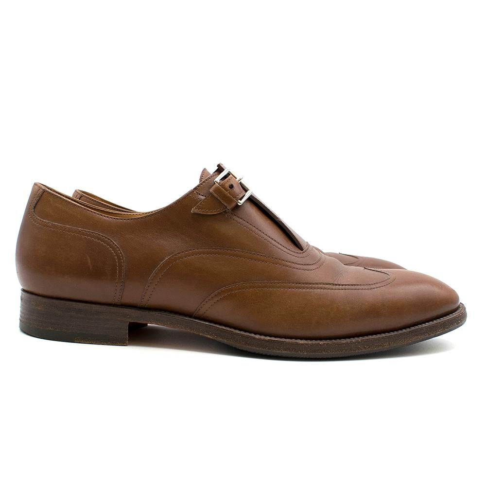 Hermes Brown Leather Monk Brogues 

- Wingtip brogue Design
- With one monk strap
- Rubber sole insert
- Leather insole
- Made in Italy

Please note, these items are pre-owned and may show some signs of storage, even when unworn and unused. This is