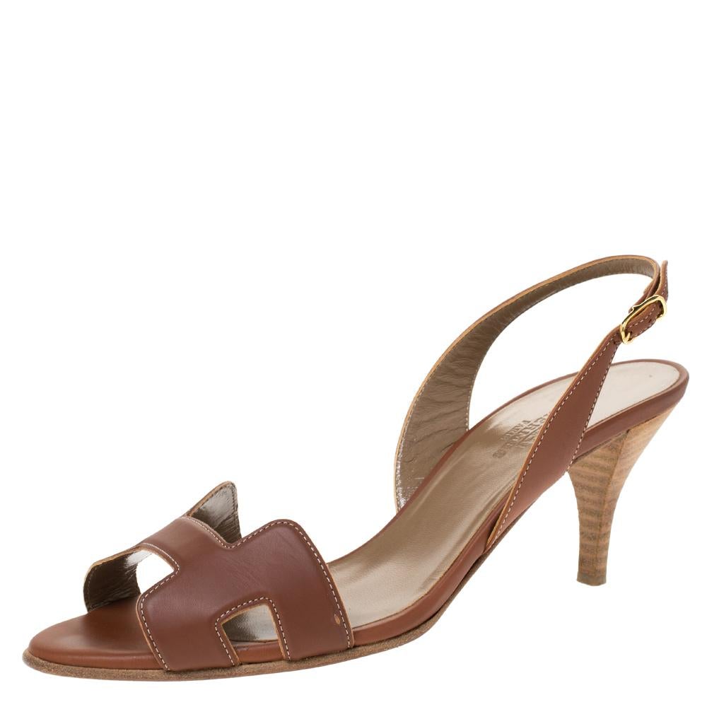 Put your best foot forward wherever you go in these pretty Hermes sandals. They've been crafted from quality leather in Italy and feature the iconic H on the vamp. Buckle-held slingbacks and stacked heels beautifully complete the pair. These sandals