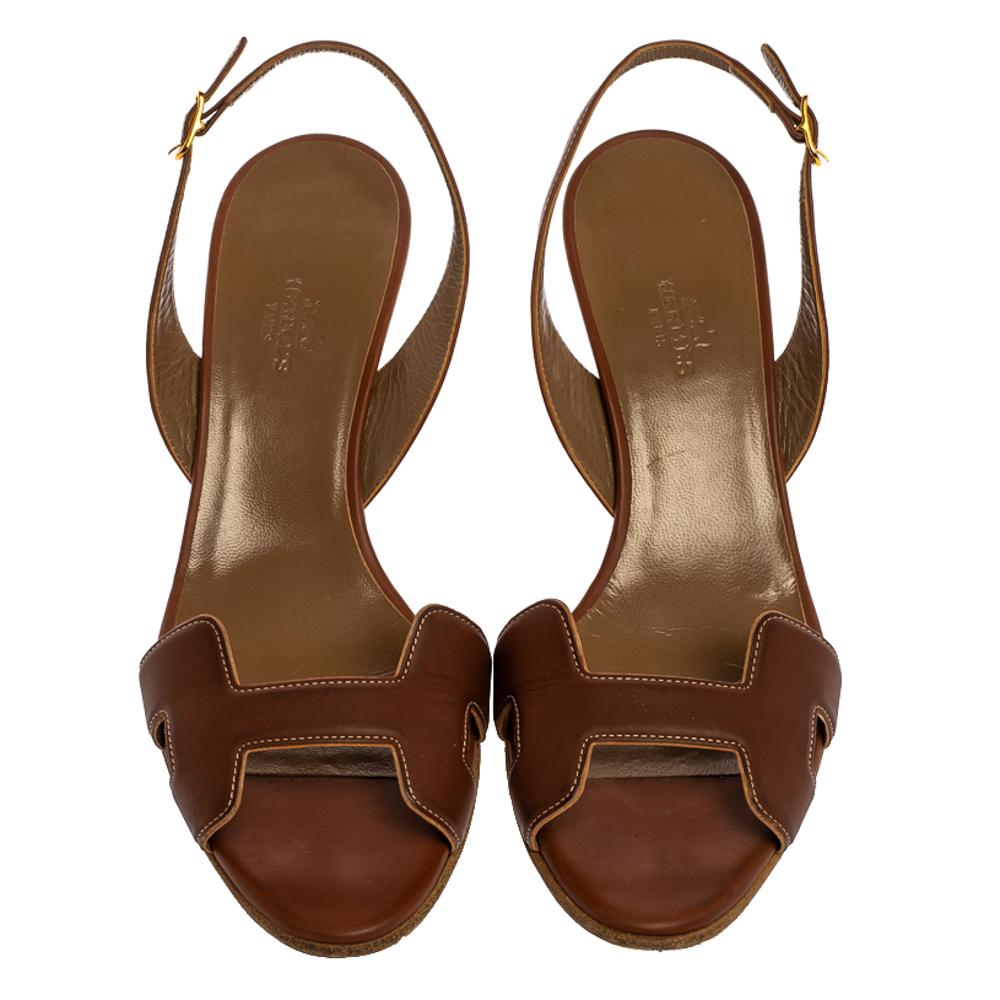 Put your best foot forward wherever you go in these pretty Hermes sandals. They've been crafted from leather in Italy and feature the iconic H on the vamp. Buckle-held slingbacks and 7 cm high heels beautifully complete the pair. These sandals are