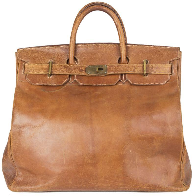 Hermes 'Haut a Courroies 45' bag in medium brown Veau Box leather. Rare vintage 1940s model with brass hardware. Unlined. Has been carried and shows an overall patina and signs of use. Please look at the pictures carefully to see condition. Overall