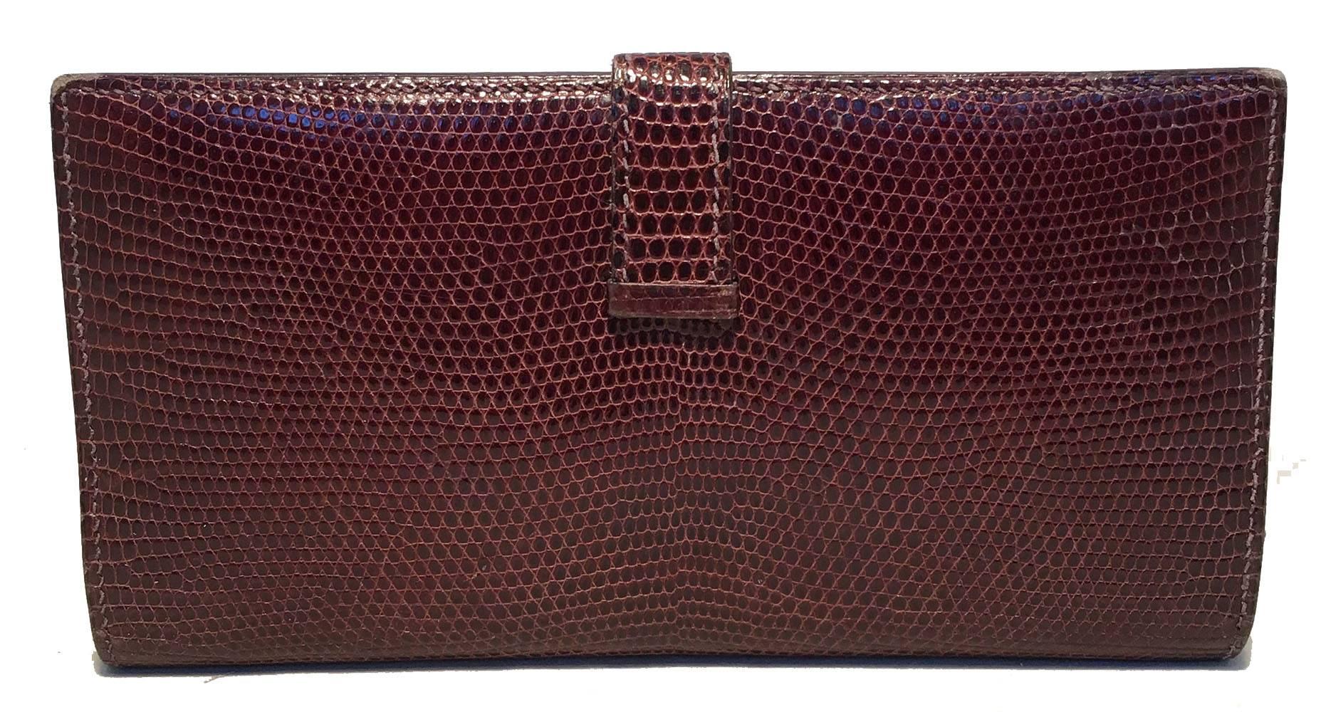 AMAZING Hermes Brown Lizard H Wallet in excellent condition.  Brown lizard leather exterior trimmed with gold hardware.  Sliding strap closure opens to a brown kidskin lined interior that holds 5 card slit pockets, 3 larger slit pockets and a