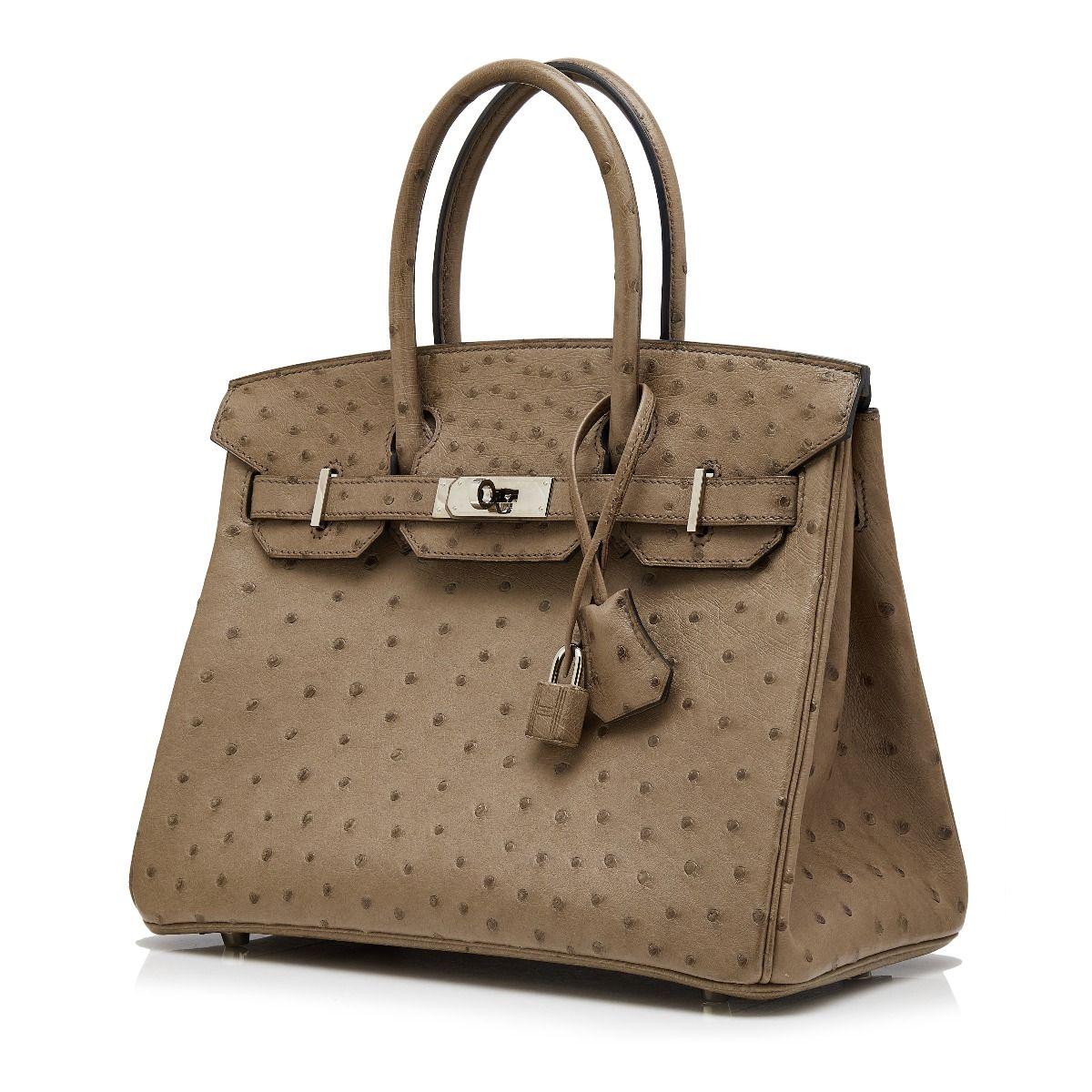 Adding a twist to the traditional Hermès Birkin, this truly spectacular, one-of-a-kind rarity showcases an earthy-brown toned exterior, crafted in ostrich skin, the rarest and most coveted of the exotic leathers, highly distinguishable by the