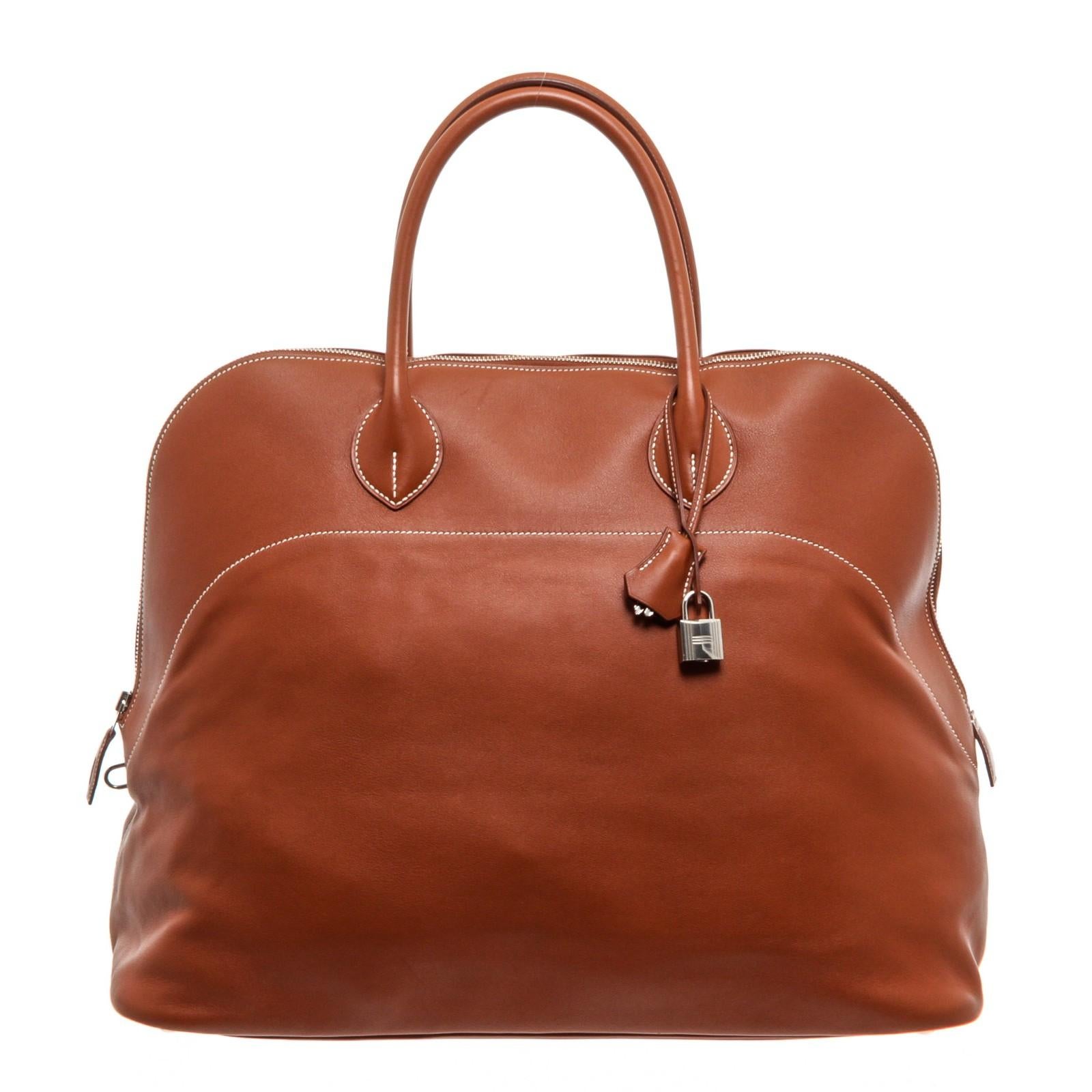 Brown Sikkim leather Hermès Bolide Relax 45 with palladium hardware, dual rolled top handles, cream contrast stitching throughout, beige toile interior lining, four slit pockets at interior wall and zip closure at top. Measurements: 20