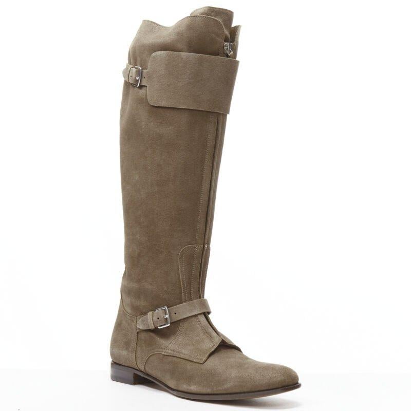 HERMES brown suede zip front silver buckle flat riding boots EU38.5 o
Reference: MELK/A00230
Brand: Hermes
Material: Suede
Color: Brown
Pattern: Solid
Closure: Zip
Lining:  Leather
Extra Details: Zip front closure. Silver-tone hardware. Buckle strap