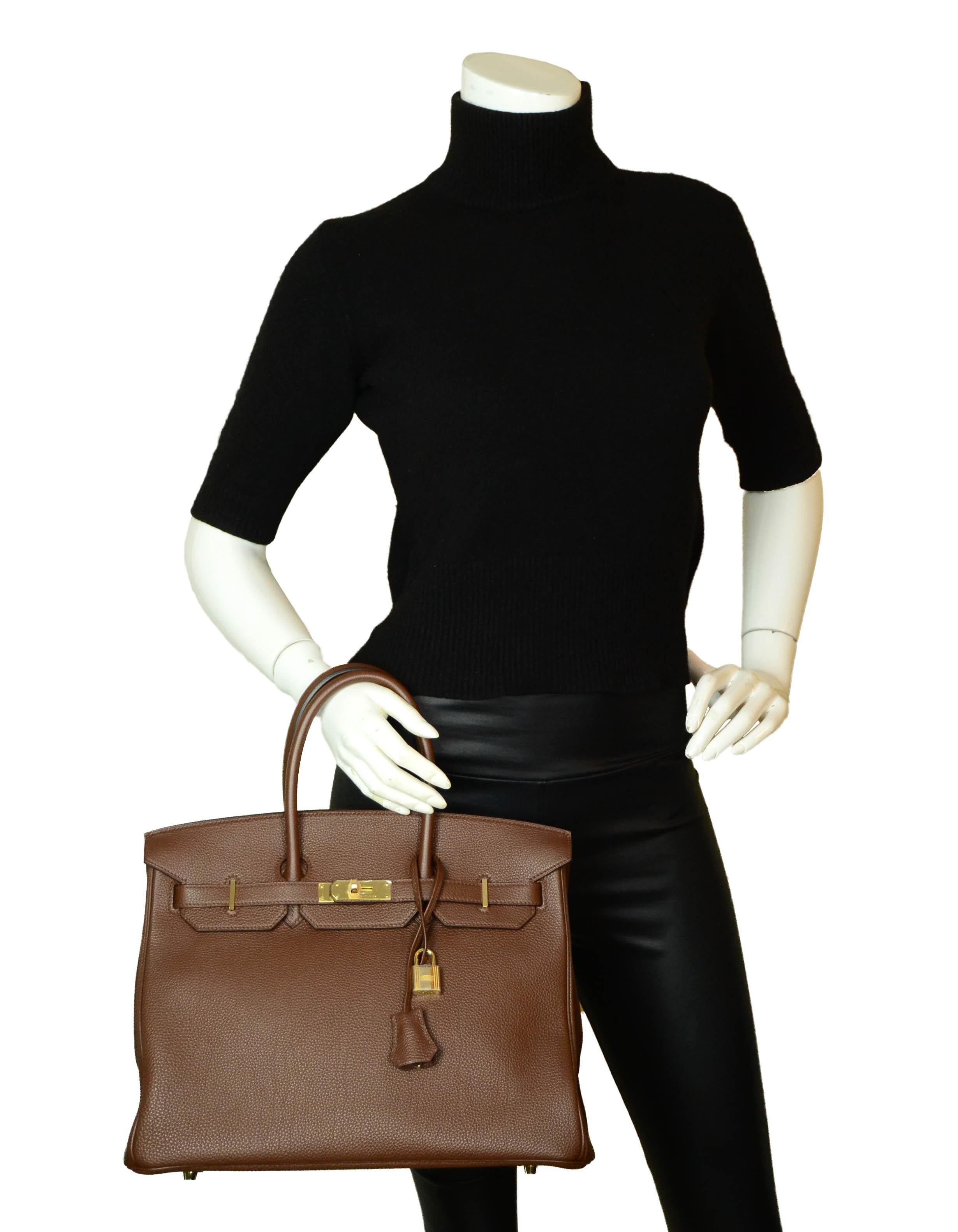 Hermes Brown Togo Leather 35cm Birkin Bag GHW

Made In: France
Year of Production: 2013
Color: Brown
Hardware: Gold
Materials: Togo
Lining: Chevre leather
Closure/Opening: Double arm strap with twist lock
Interior Pockets: One zip and one