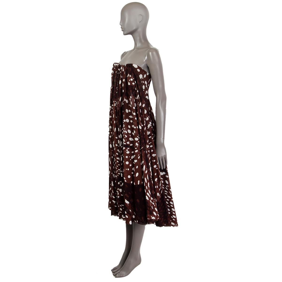 Hermés sleeveless dotted maxi dress in brown and off-white silk (100%). Fastens with an adjustable draw sting. Dress can also be worn as a skirt. Unlined and is semi-sheer. Has been worn and is in excellent condition. 

Tag Size 44
Size XL
Bust
