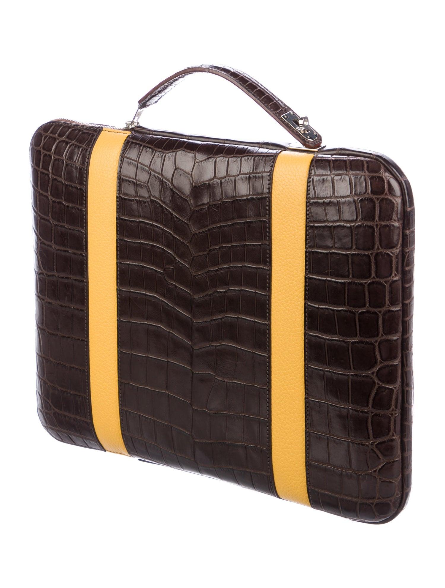 The Hermes Business Bag is Sophistication at its Finest.

Exemplifying elegance, prestige and sophistication, this Hermes business bag is crafted of exotic alligator skin in rich chocolate brown and accented in yellow leather. Brand new and in