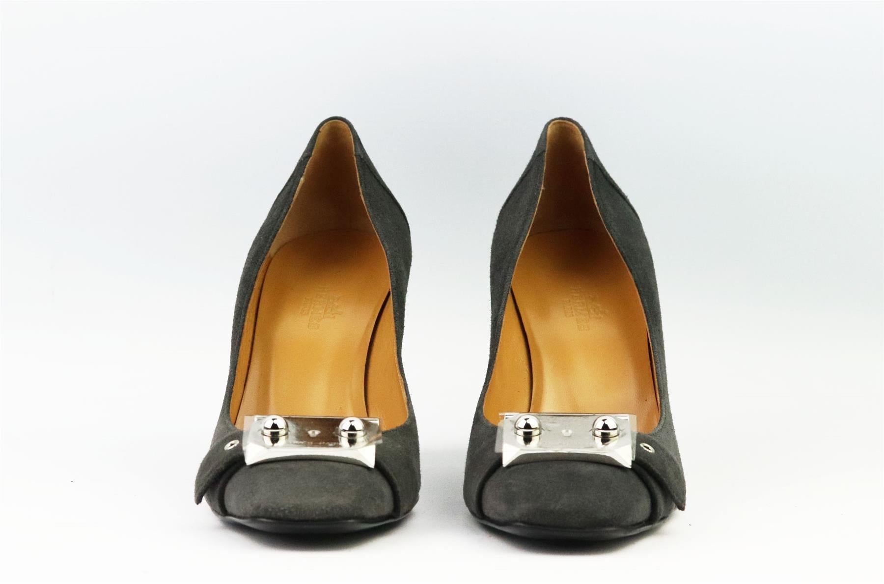 These pumps by Hermès are a classic style that will never date, made in Italy from supple grey suede, they have square toes and silver-tone buckle detail that can be seen throughout Hermès collections. Heel measures approximately 76 mm/ 3 inches.