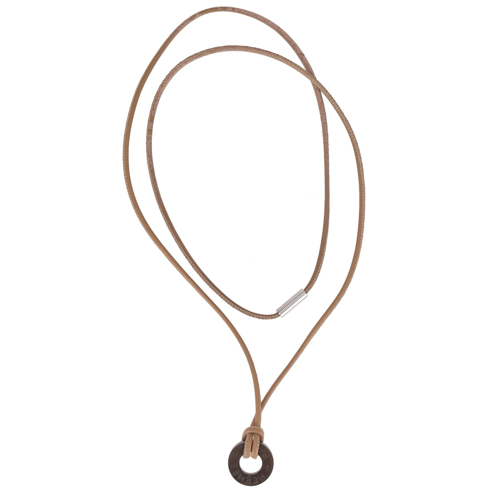 Hermes Buffalo Horn Logo Pendant Necklace

Brown ring pendant crafted in buffalo horn and detailed with 'Hermes Paris' engravement.

Featuring light brown leather cord with branded silver buckle.

Size – One Size

Condition – Good/Very Good