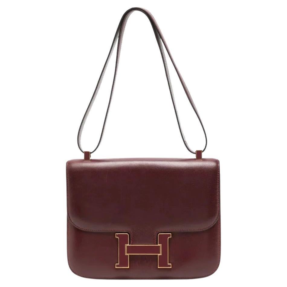 How do you open a Hermès Constance handbag without scratching the leather exterior?