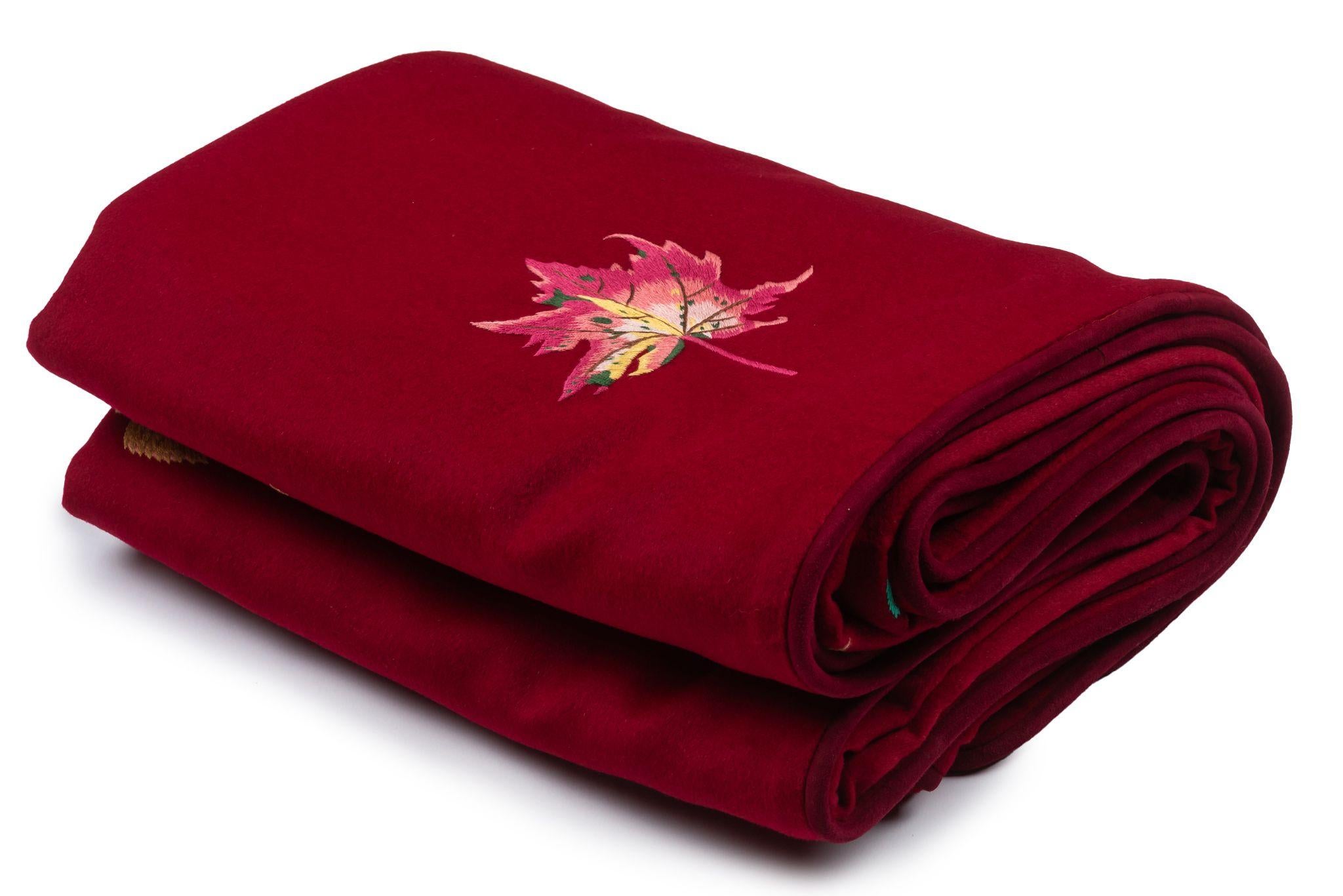 Hermès collectible burgundy king size blanket with embroidered leaves and flowers. Wool, cashmere, angora and suede trim. 
70% wool, 15% cashmere, 15% angora.
Mint condition.